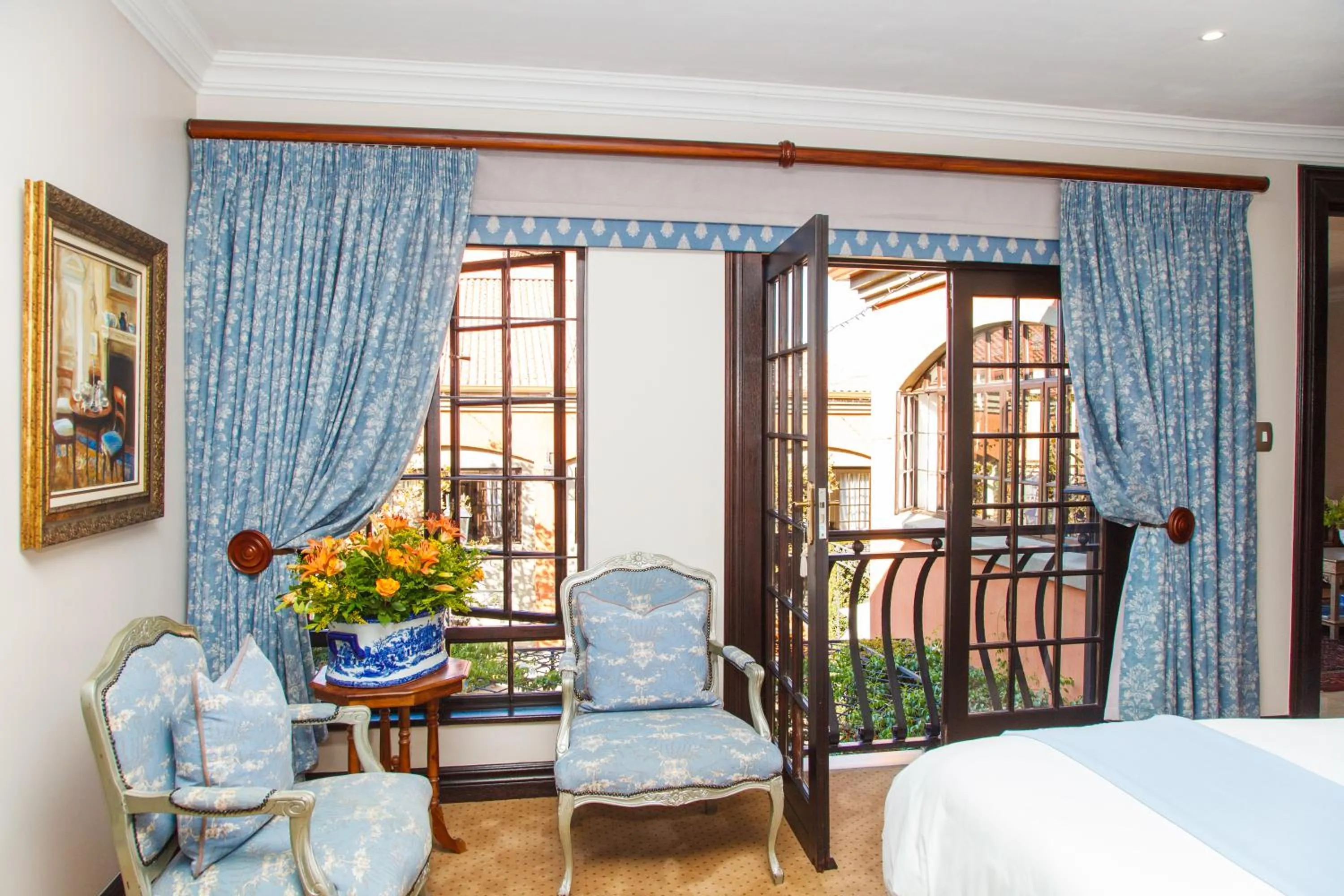 Seating area, Bed in Ivory Manor Boutique Hotel