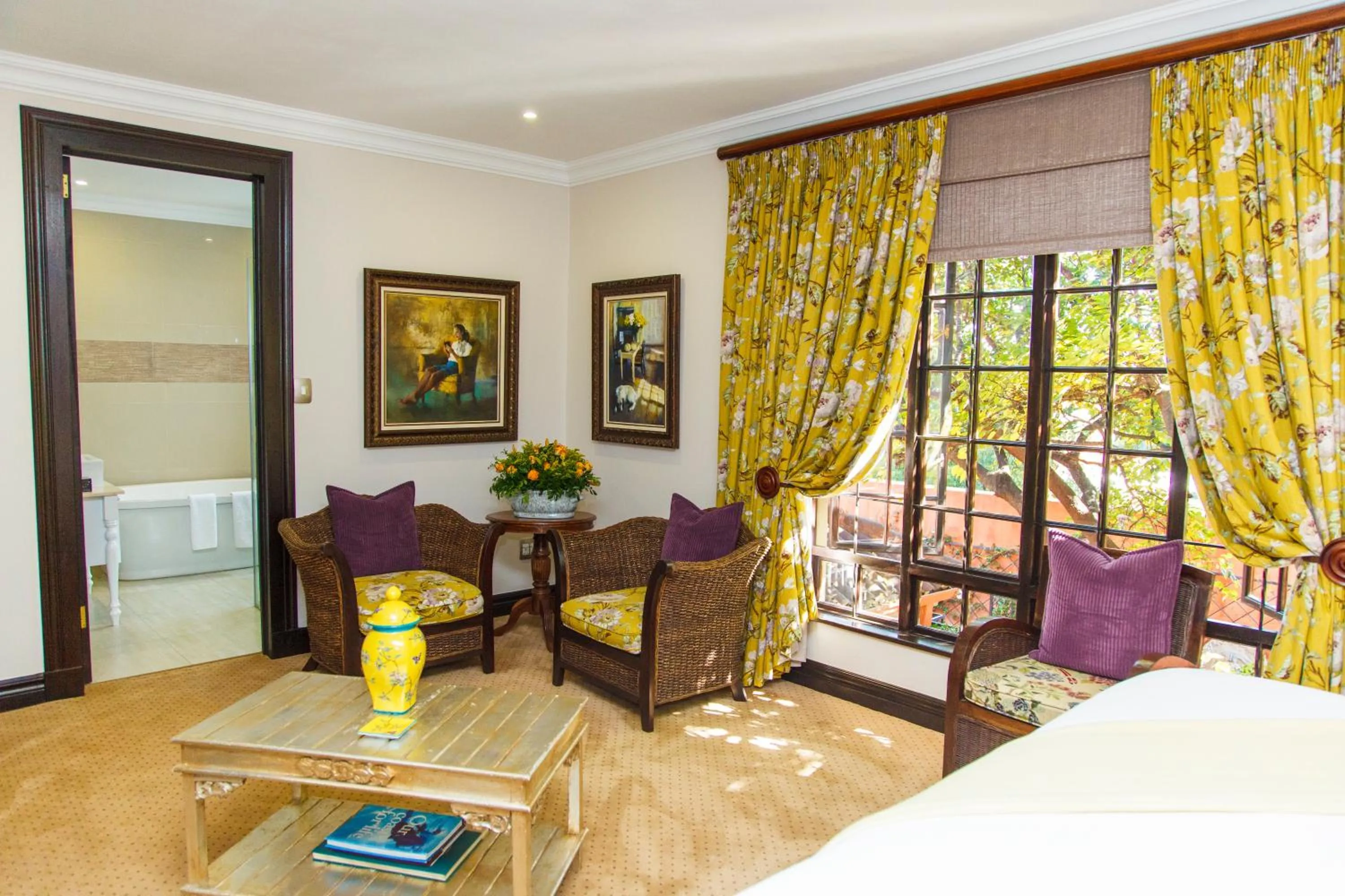 Seating area, Bed in Ivory Manor Boutique Hotel