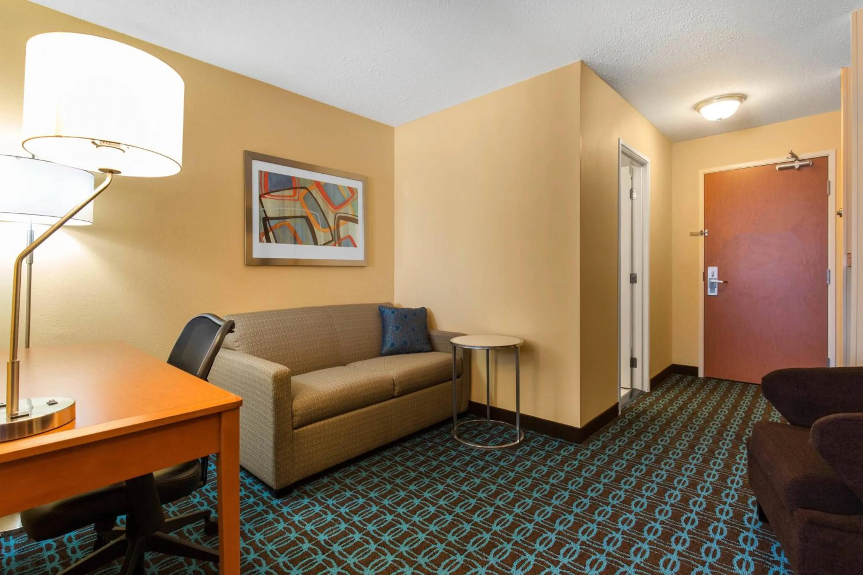 Living room in AmericInn by Wyndham St Cloud MN Shopping Area