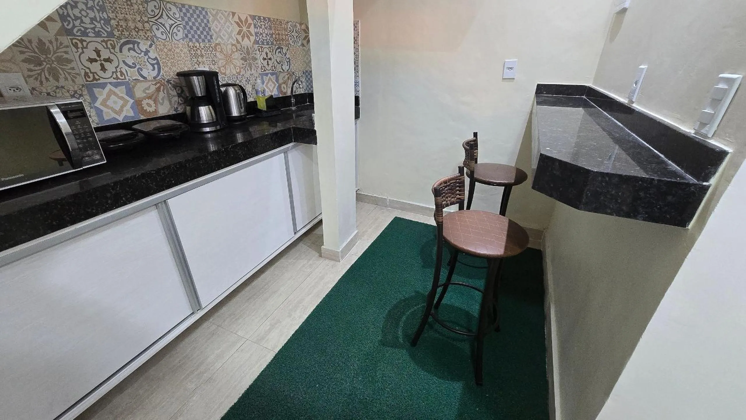 Communal kitchen in Recanto Del Mare Suítes