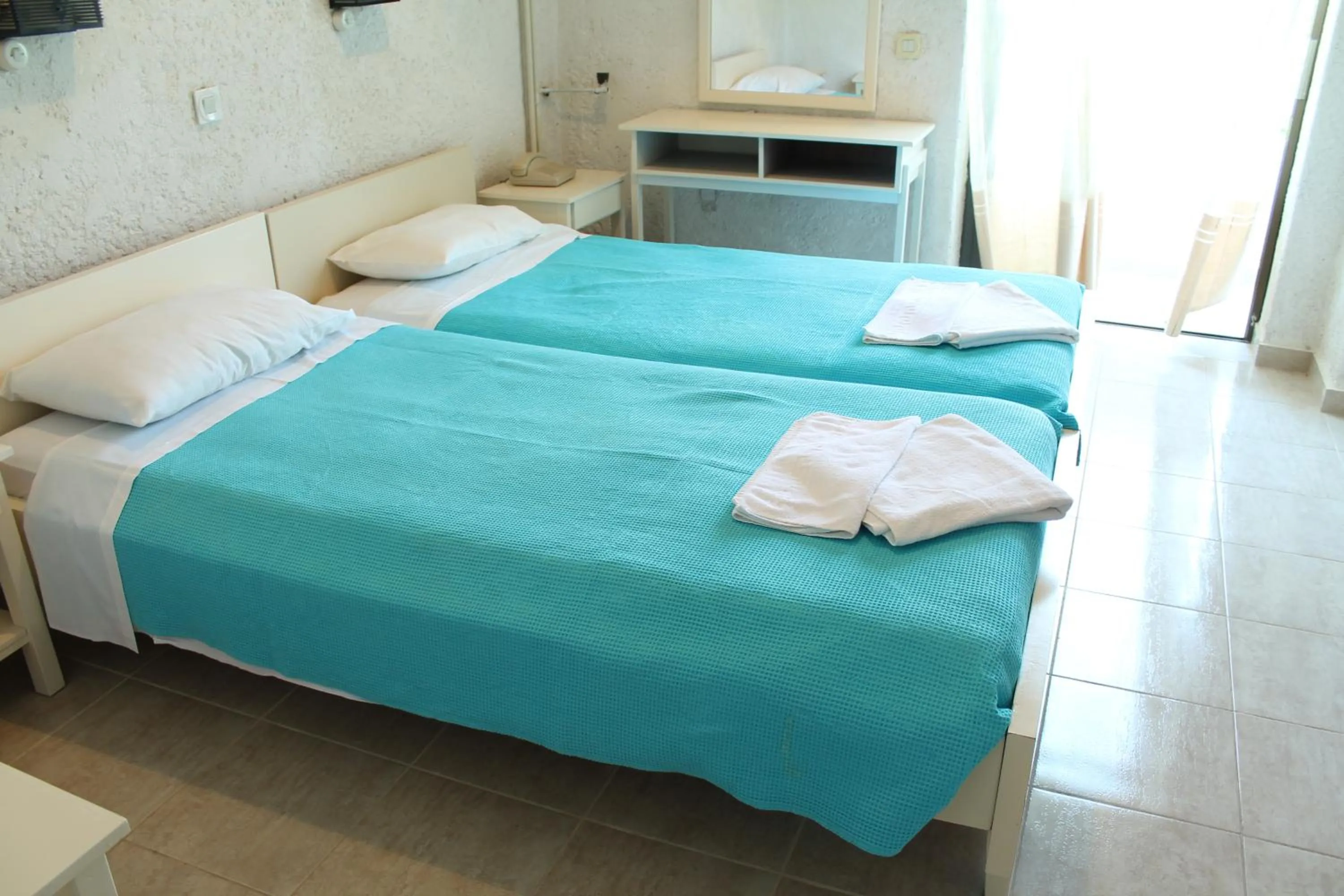 Bed in Esperides Hotel