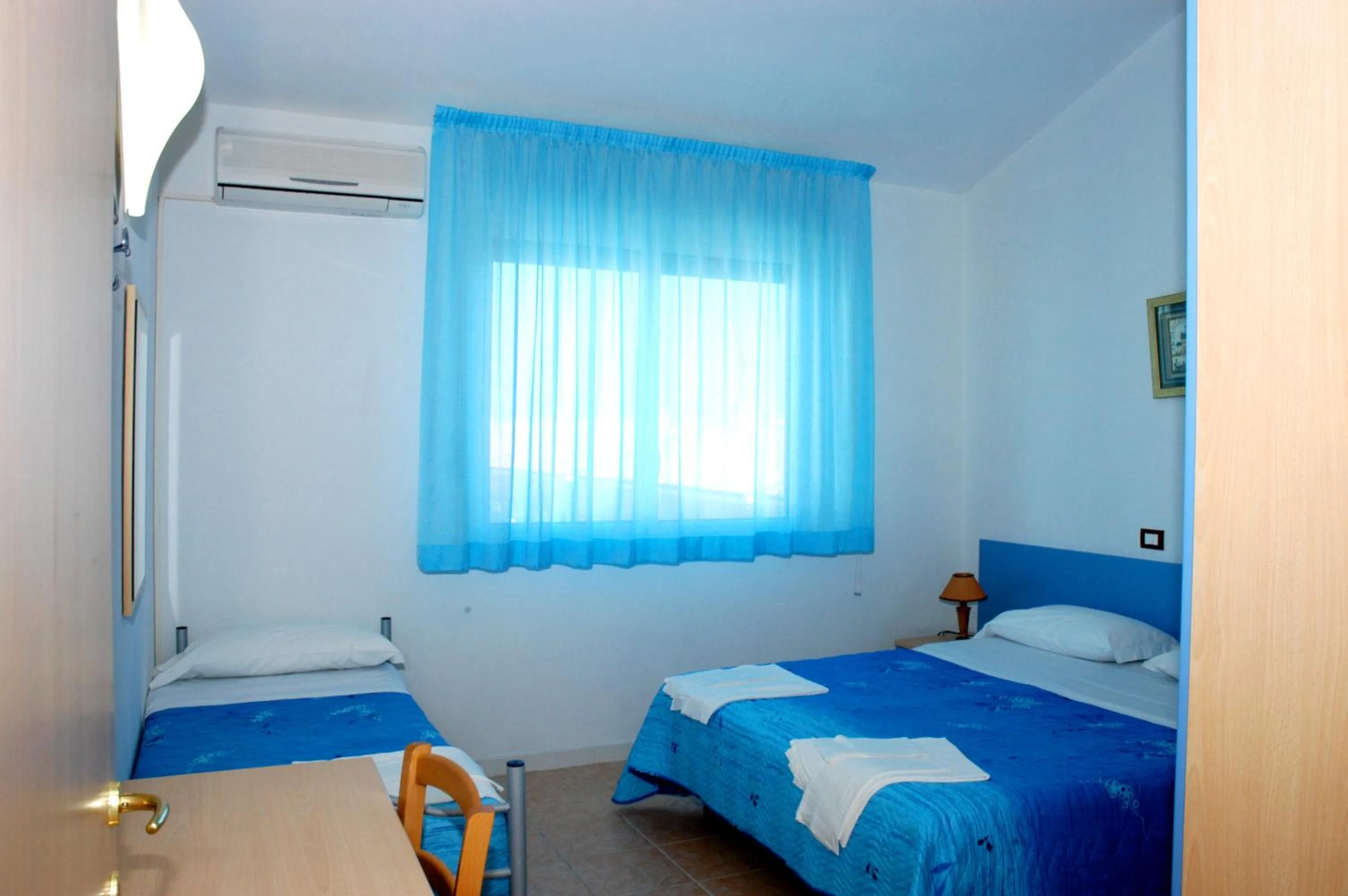 Bed in Long Beach Village Residence on the sea with private beach included