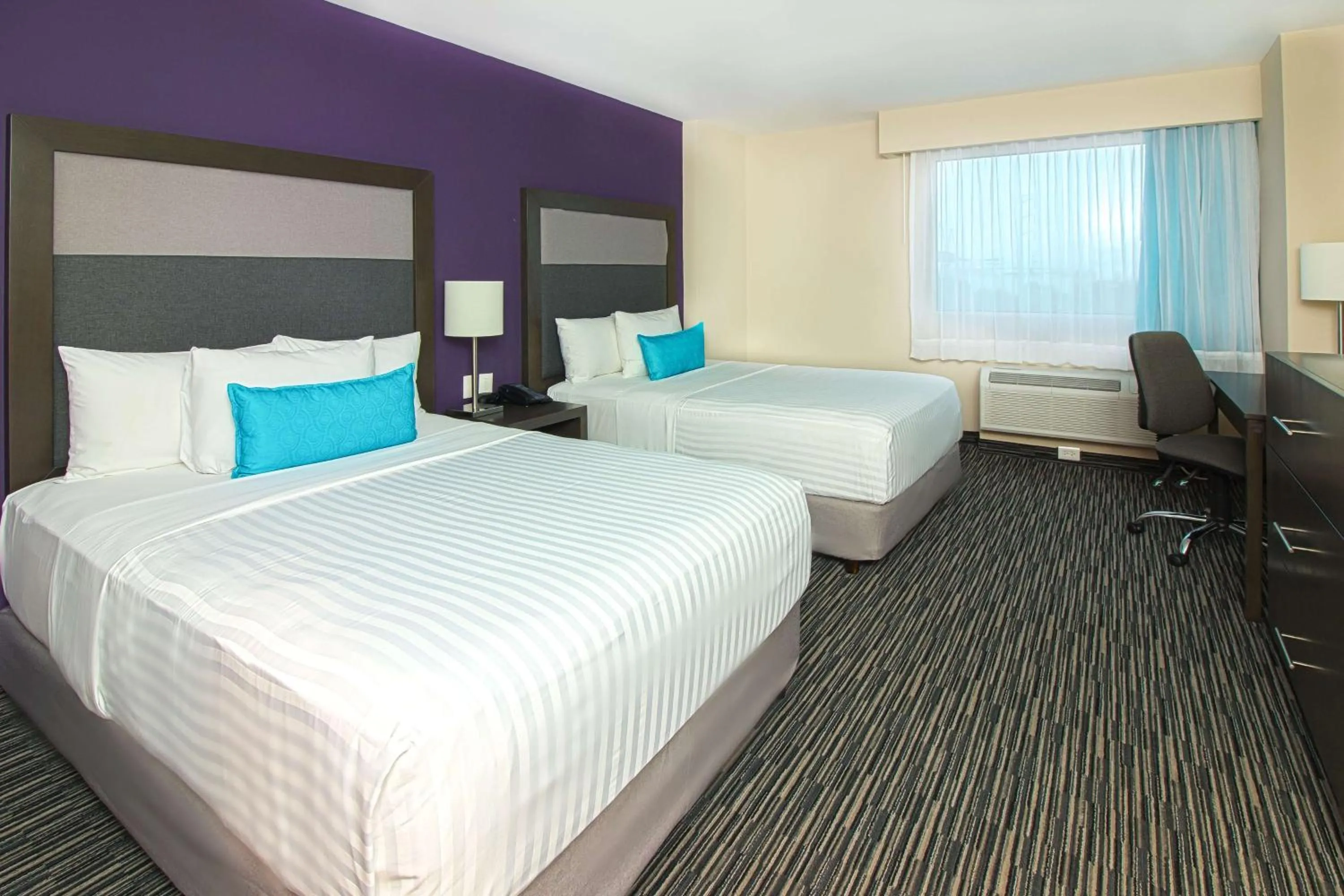Photo of the whole room, Bed in CHN Hotel Monterrey Aeropuerto, Trademark by Wyndham