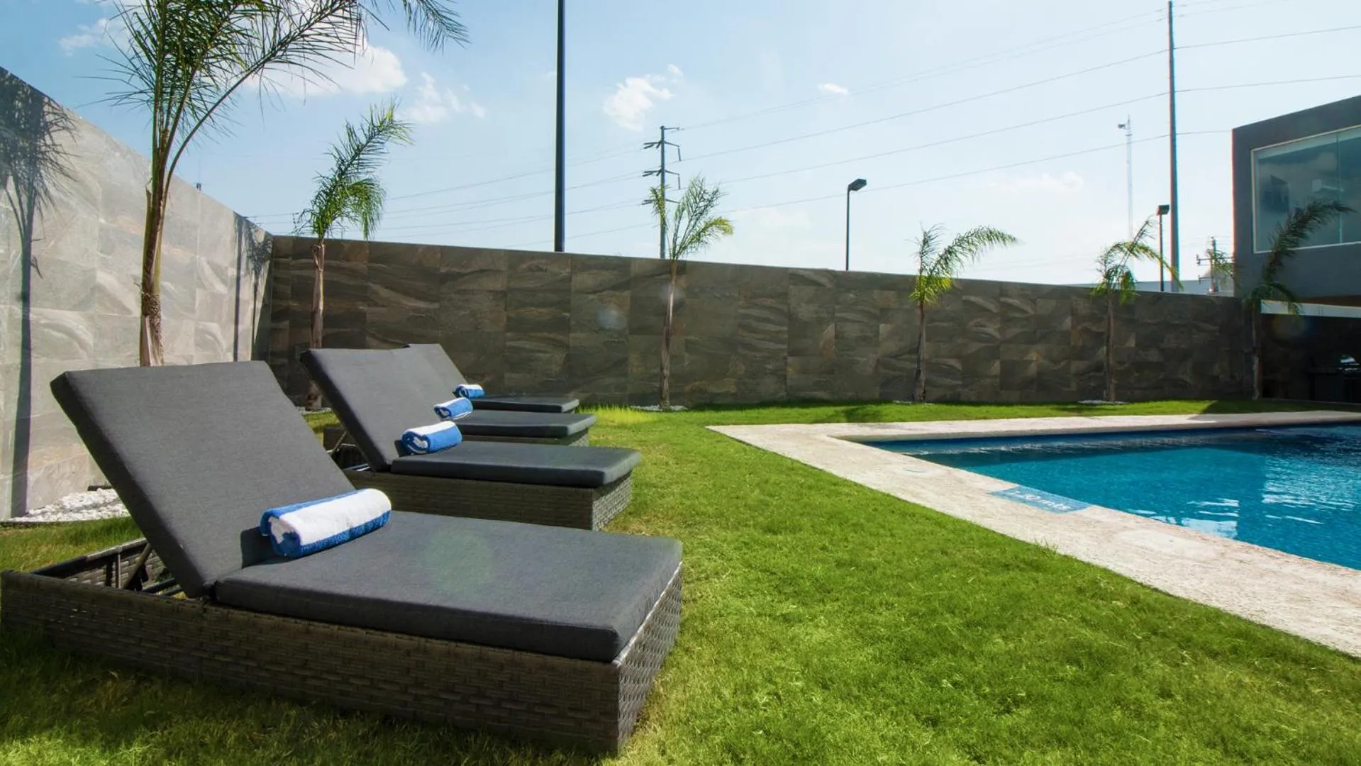 Swimming pool in CHN Hotel Monterrey Aeropuerto, Trademark by Wyndham