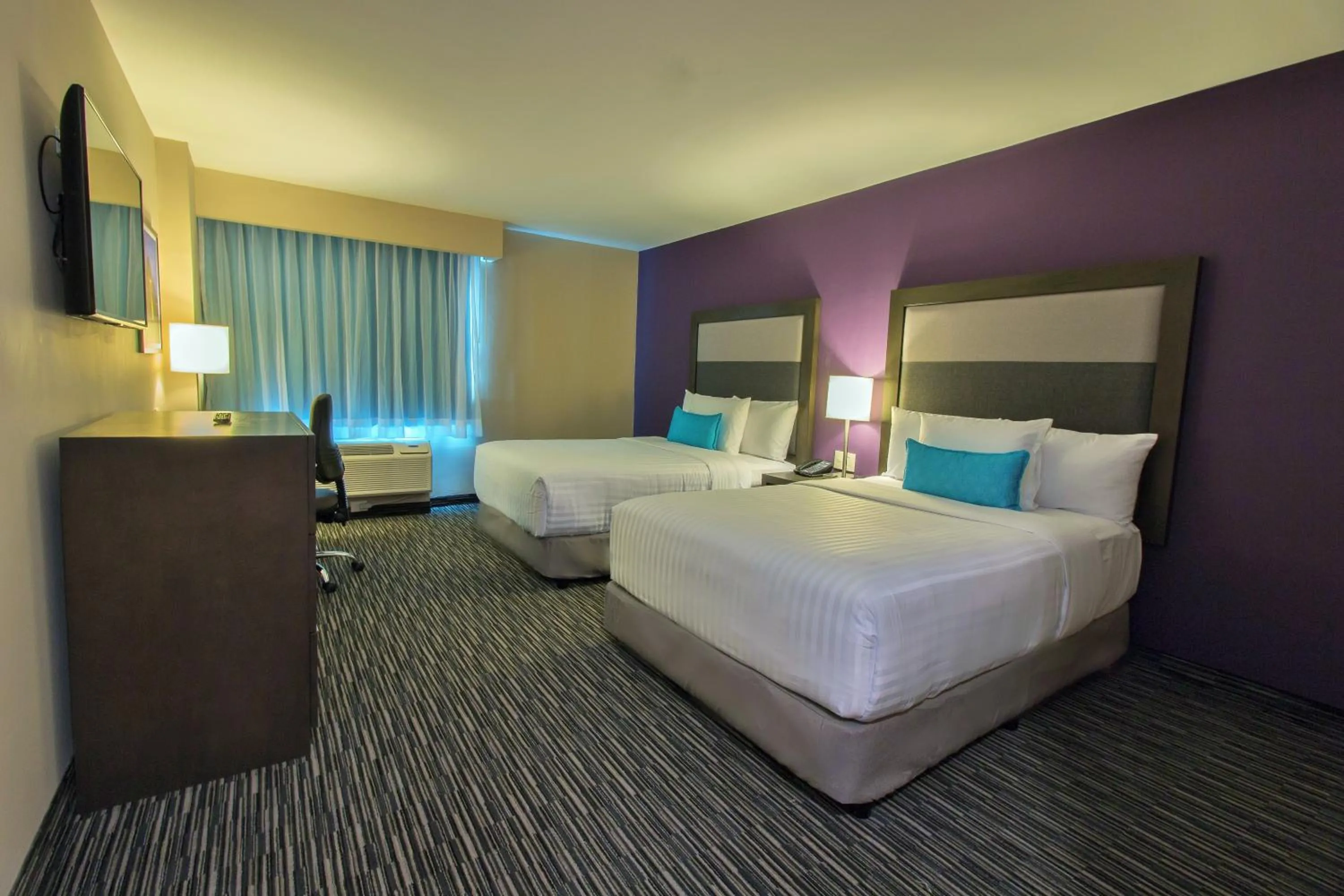 Bed in CHN Hotel Monterrey Aeropuerto, Trademark by Wyndham