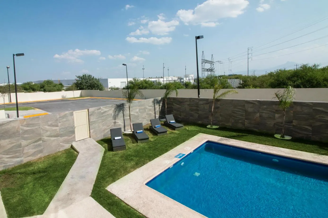 Swimming pool in CHN Hotel Monterrey Aeropuerto, Trademark by Wyndham