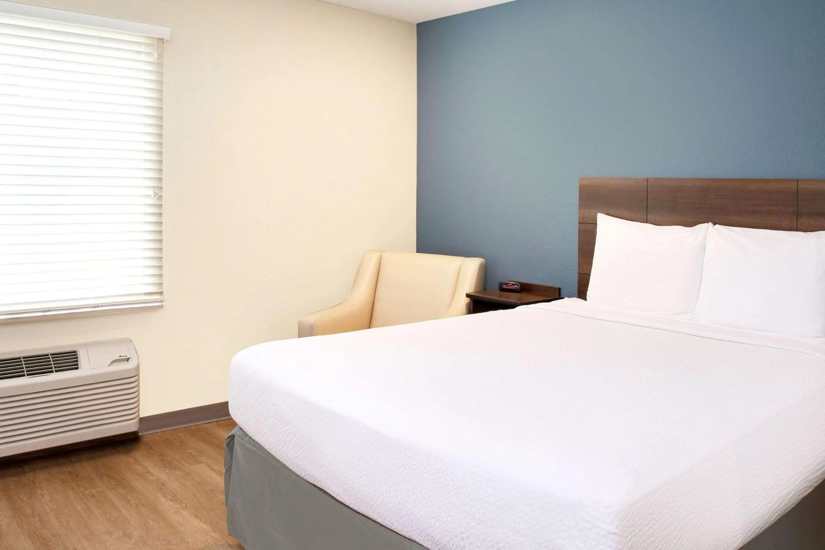 Photo of the whole room, Bed in WoodSpring Suites Nashville Airport
