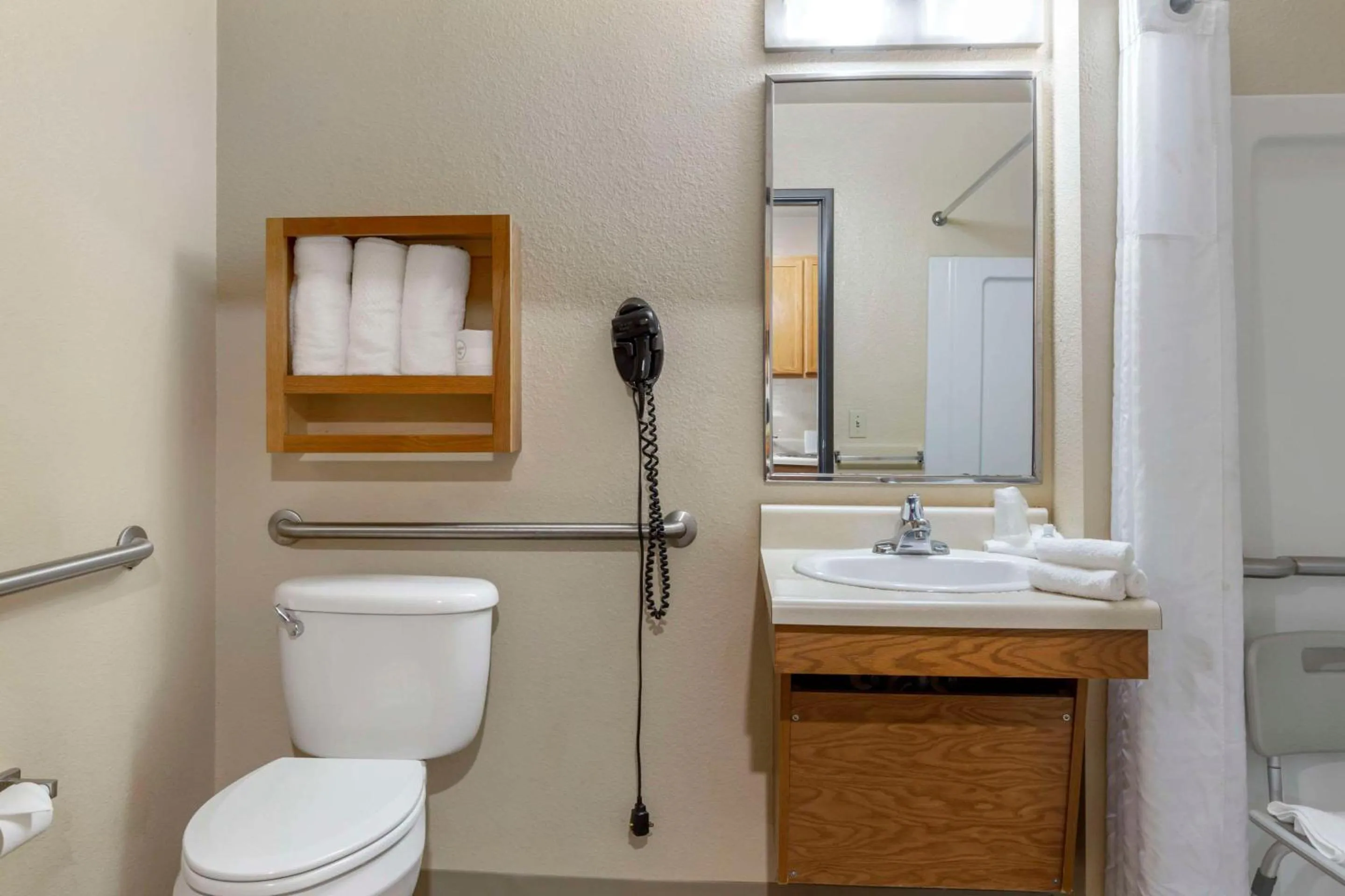 Bedroom in WoodSpring Suites Raleigh Garner