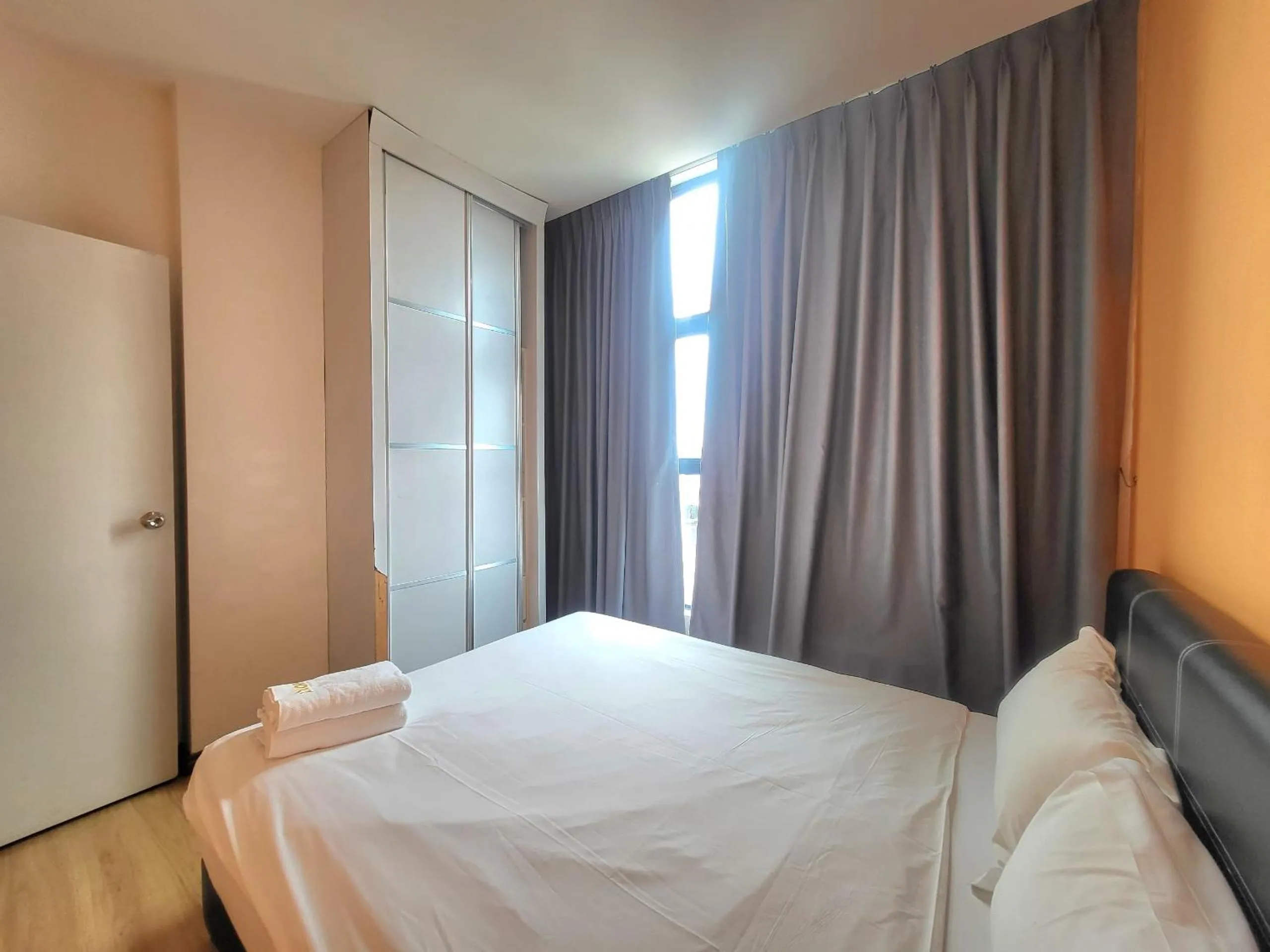 Bed in Roxy Hotel & Apartments