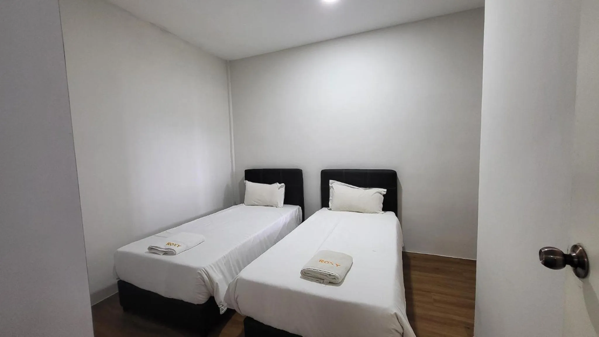 Bed in Roxy Hotel & Apartments