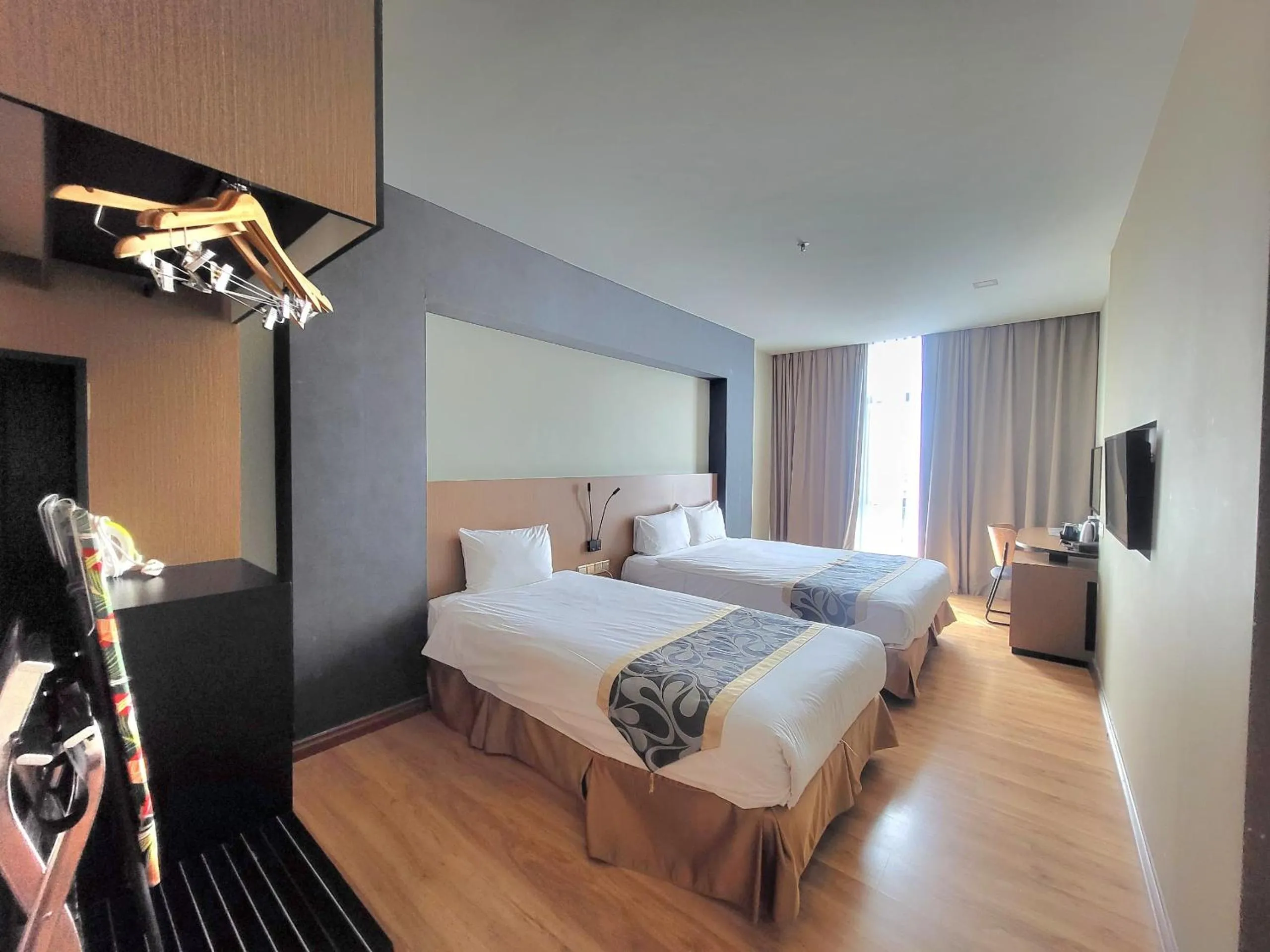 Bed in Roxy Hotel & Apartments