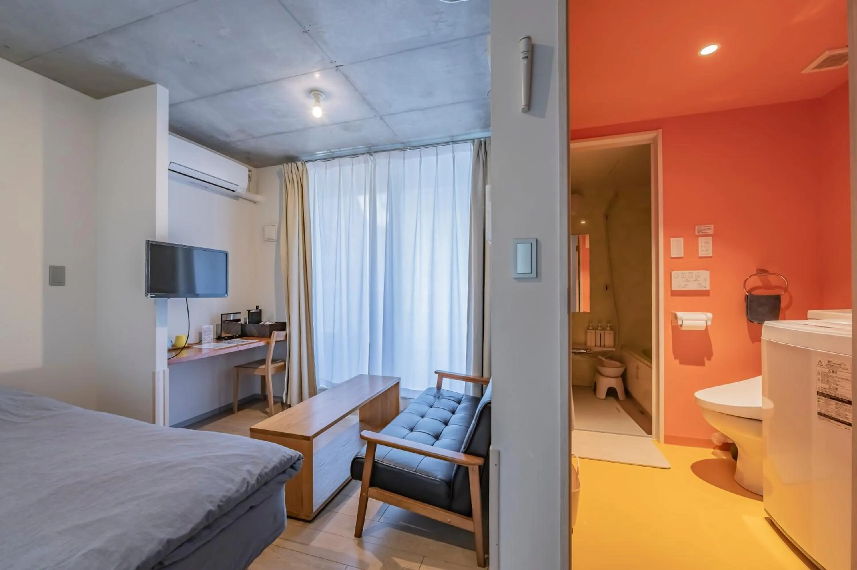 Living room, Bed in bmj Shinjuku Okubo