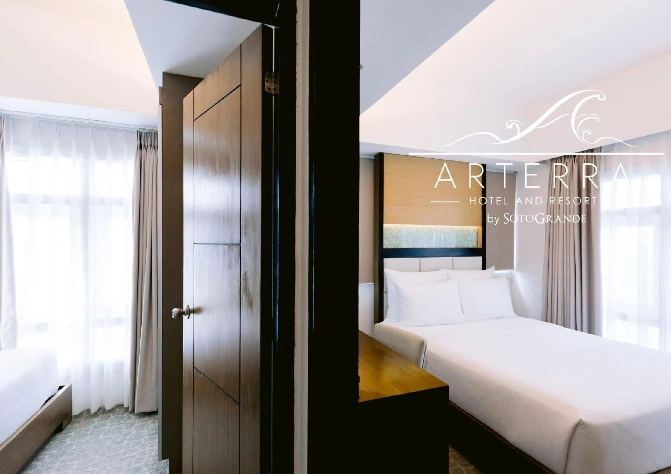 Bed in Arterra Hotel and Resort