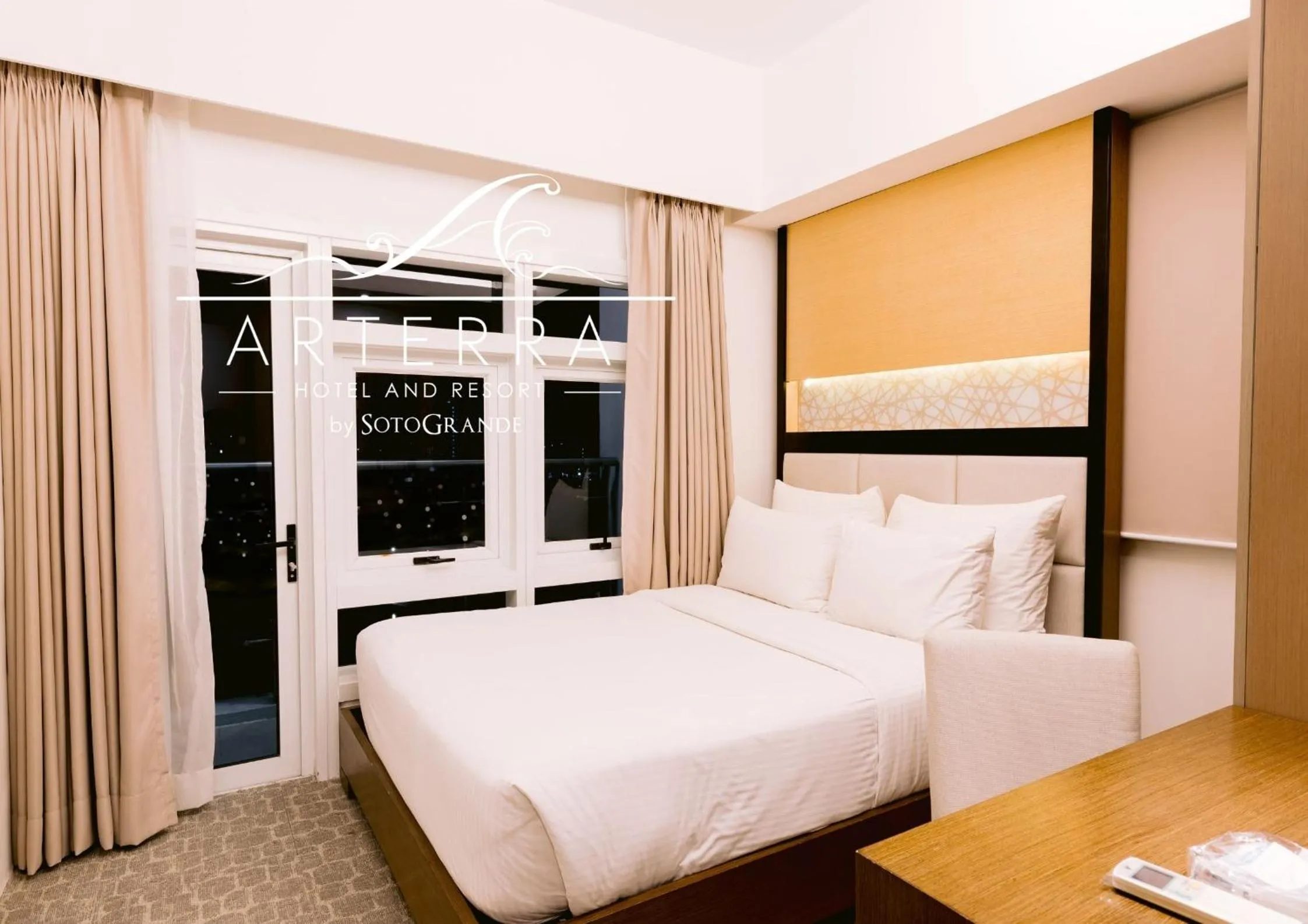 Bed in Arterra Hotel and Resort