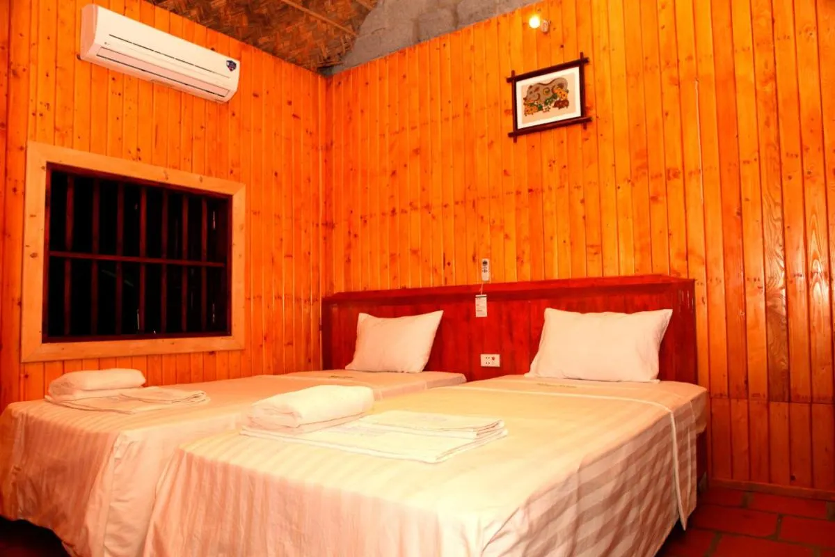 Bed in Whisper Nature Bungalow & Resort
