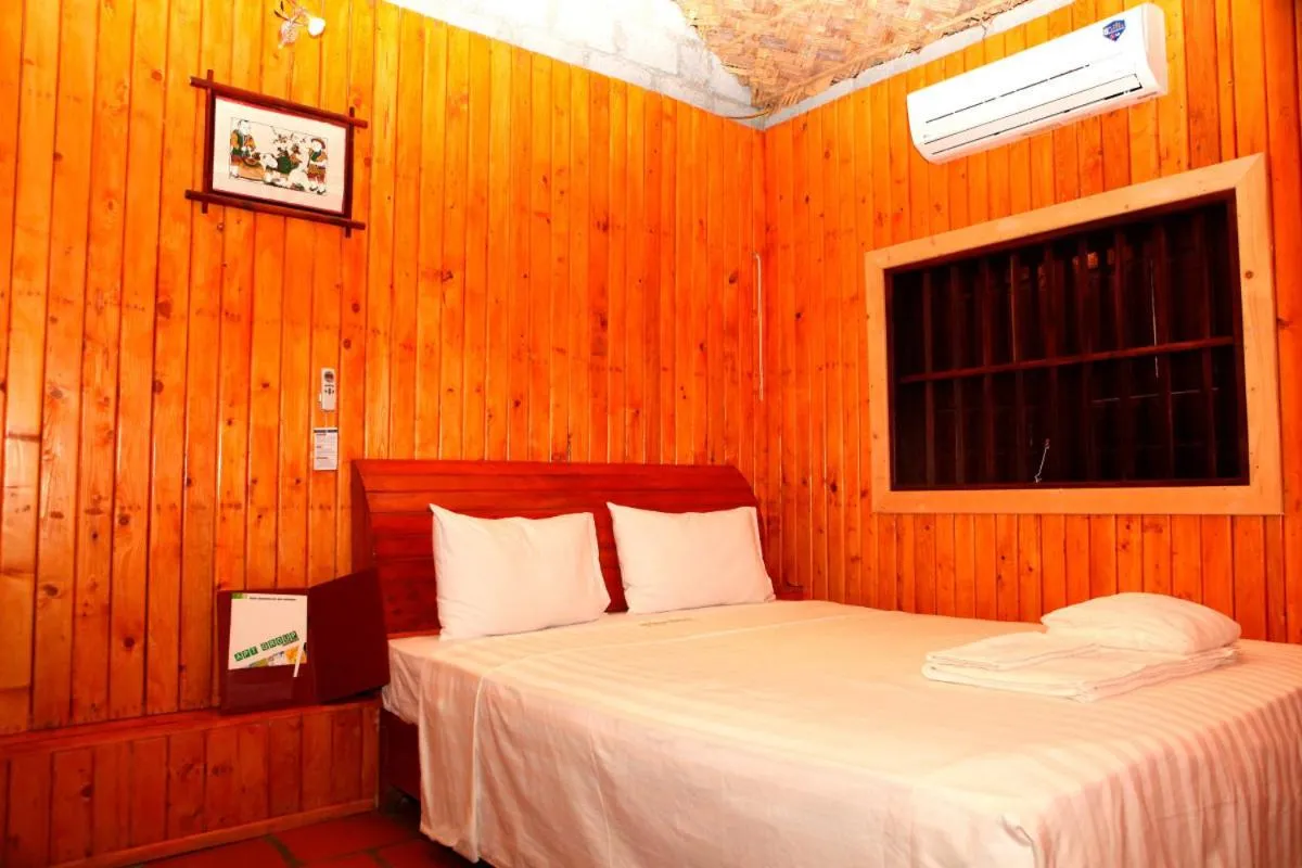 Bed in Whisper Nature Bungalow & Resort