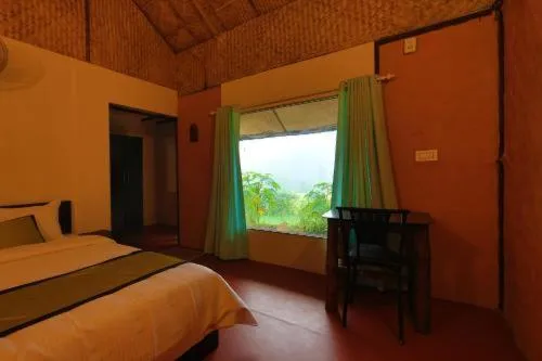 Bed in KOOMANKOLLY RESORT