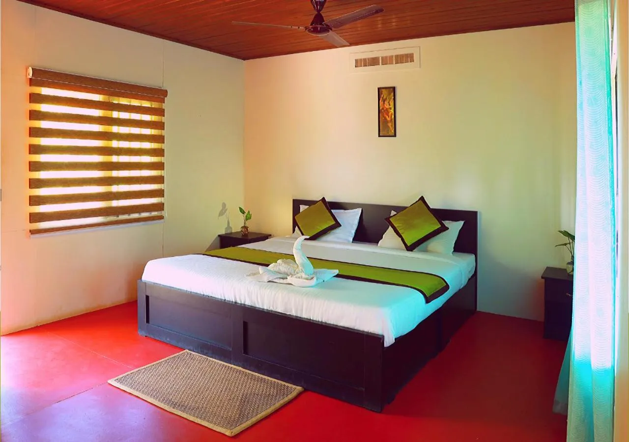 Bed in KOOMANKOLLY RESORT