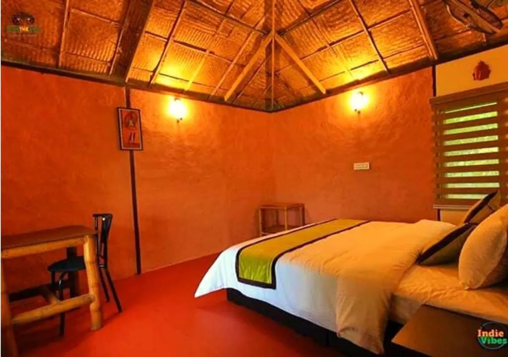 Bed in KOOMANKOLLY RESORT