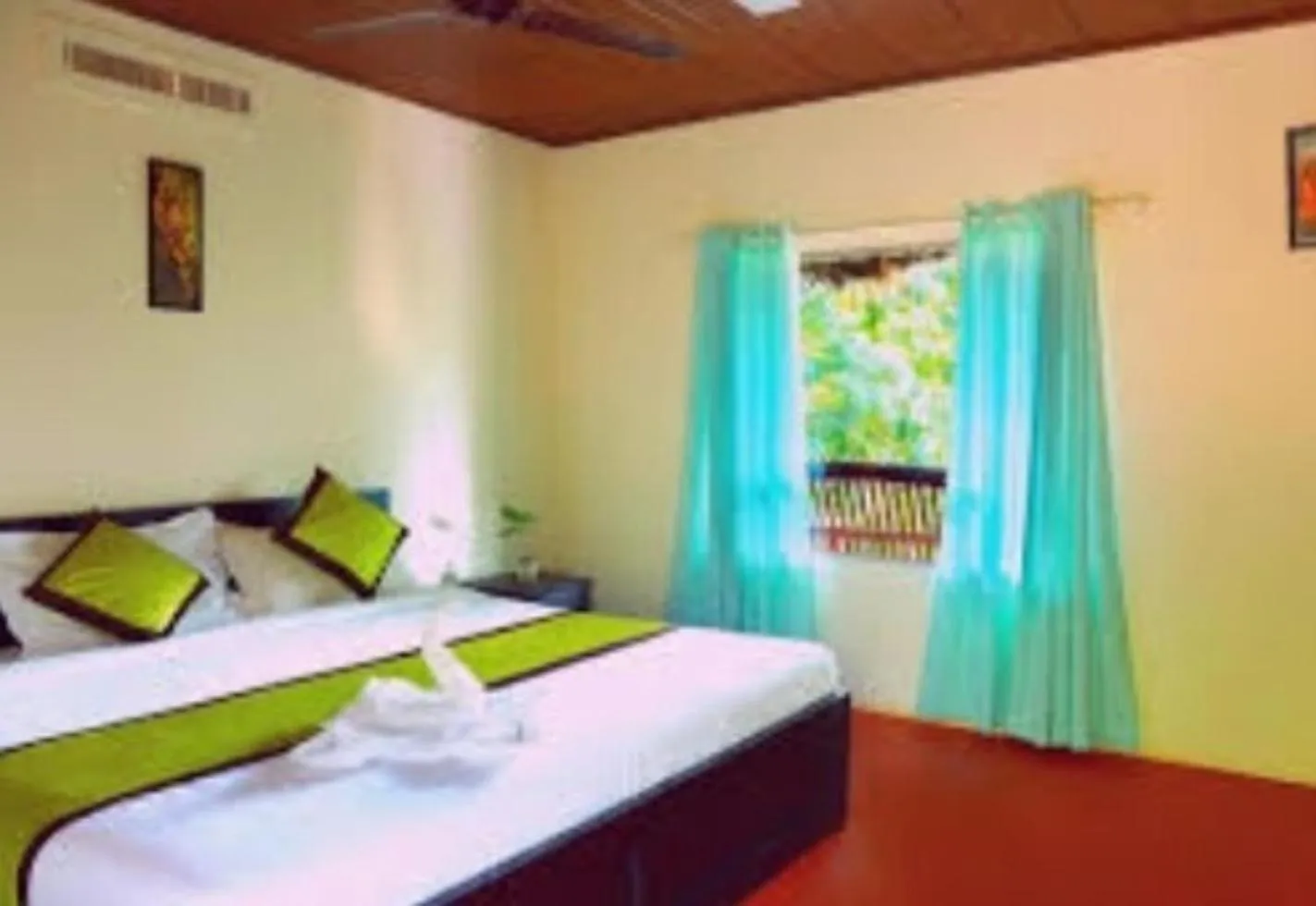 Bed in KOOMANKOLLY RESORT