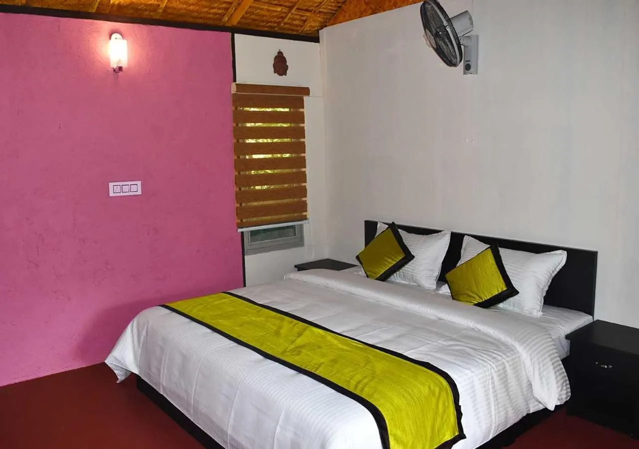 Bed in KOOMANKOLLY RESORT