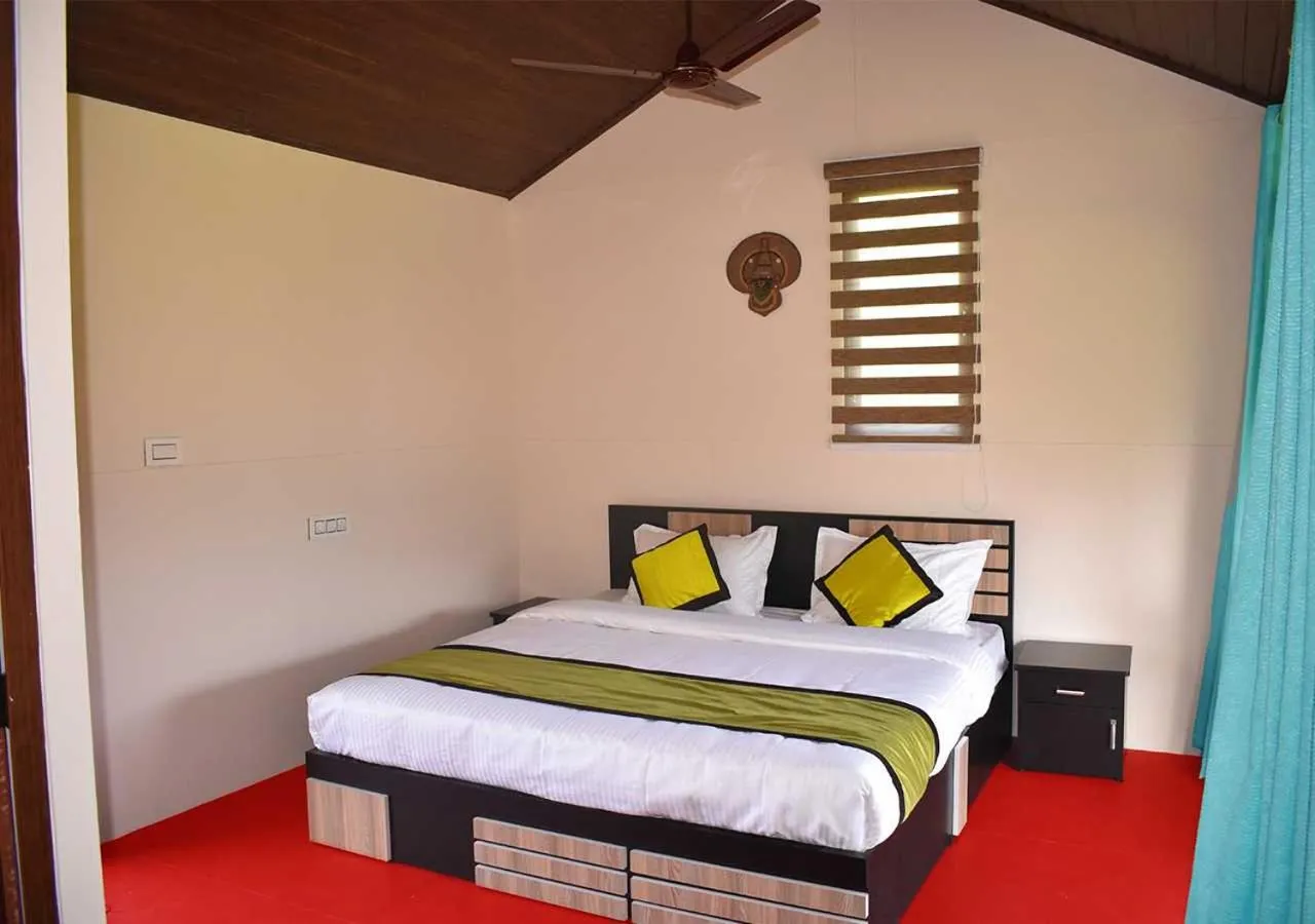 Bed in KOOMANKOLLY RESORT