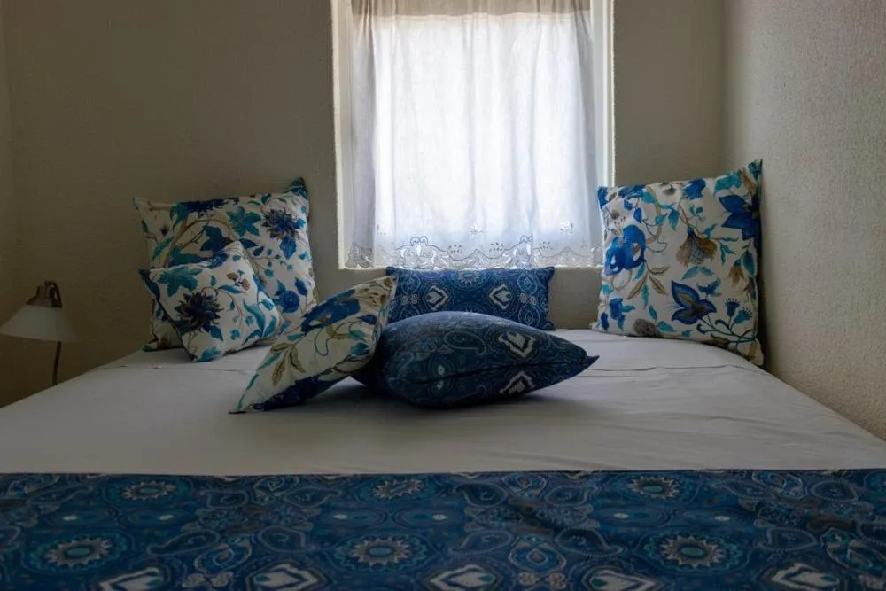 Bedroom, Bed in Grand Bleu Apartments & Villas