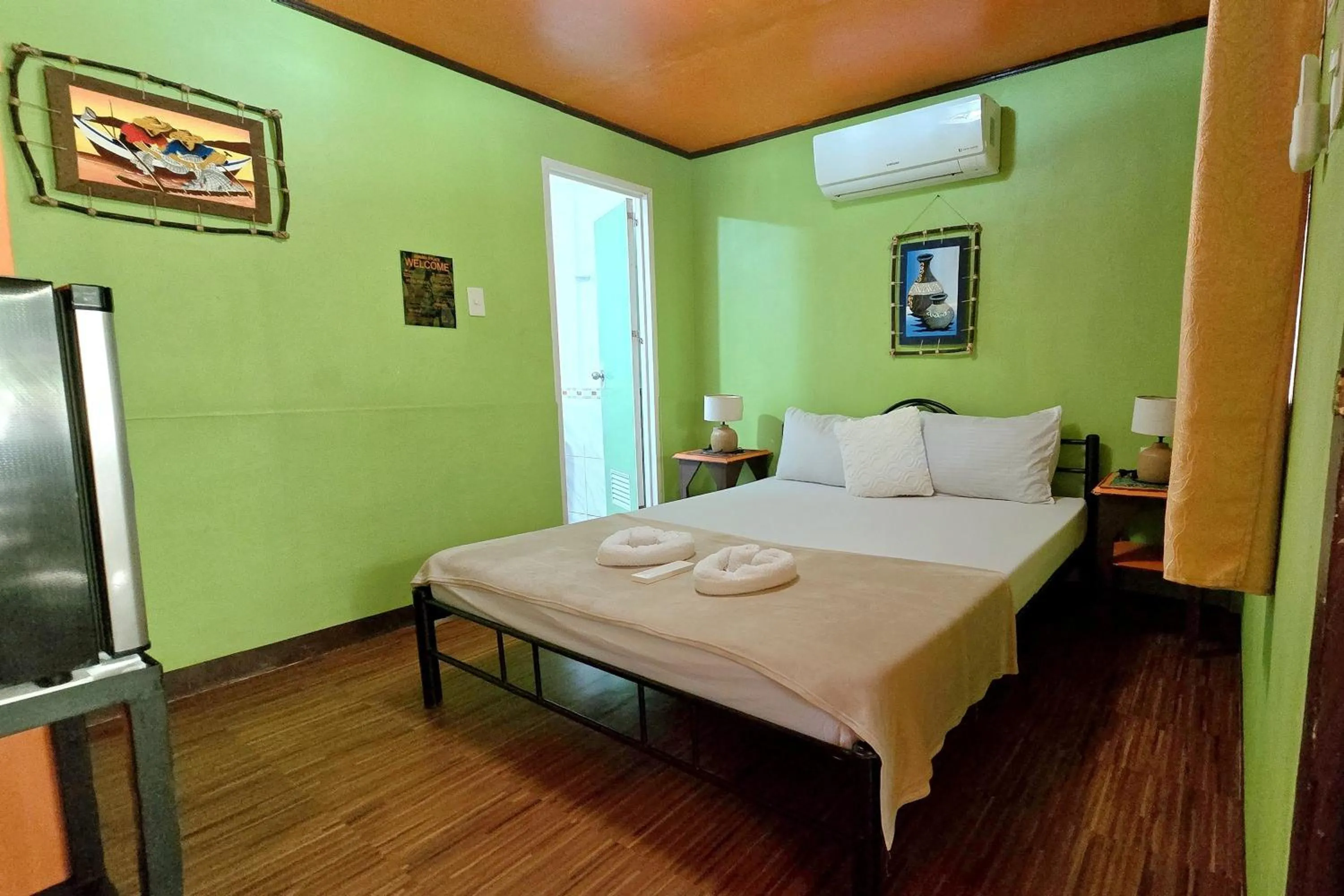 Bed in ADRIANA's PLACE TROPICAL GUESTHOUSE