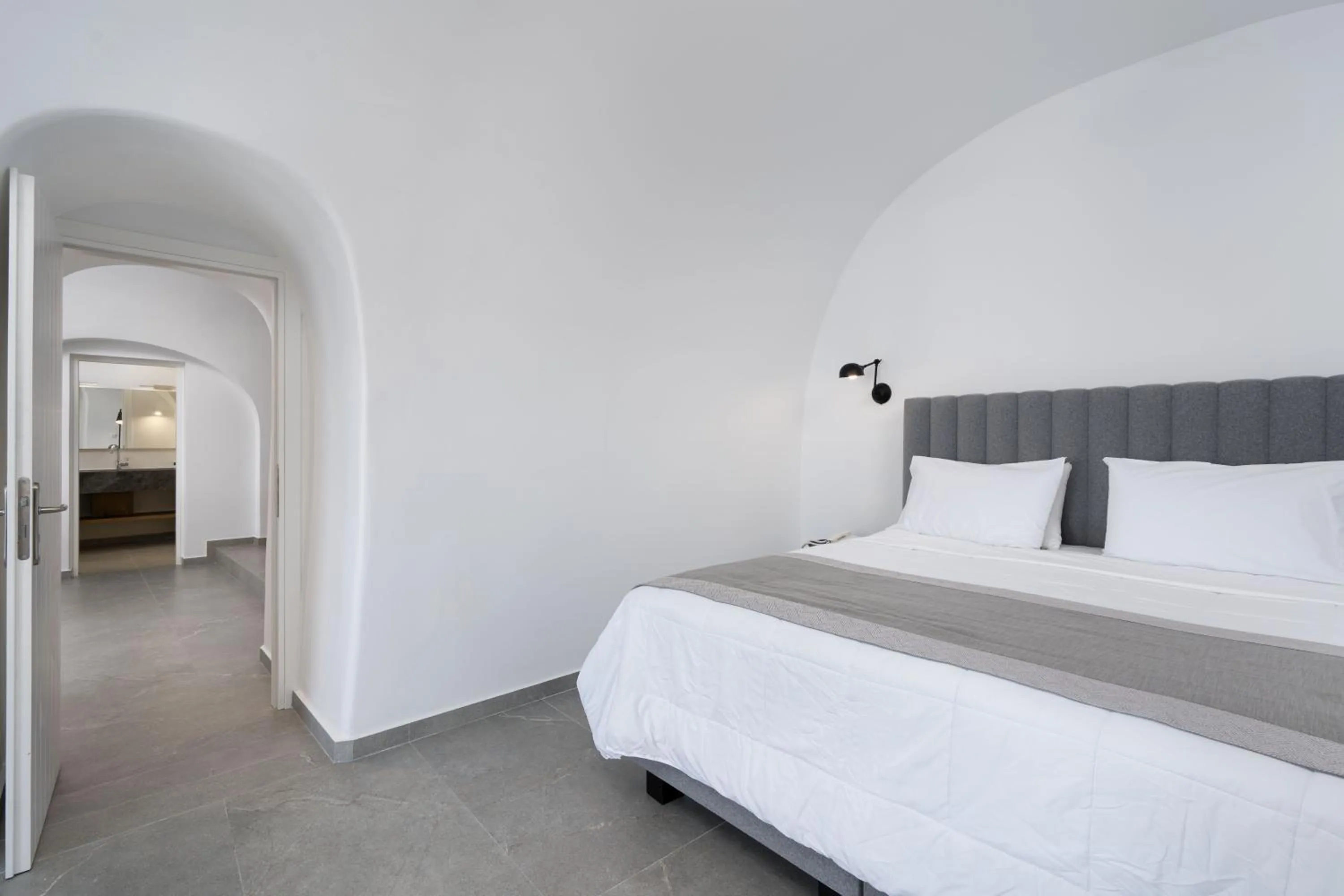 Bed in Petit Palace Suites