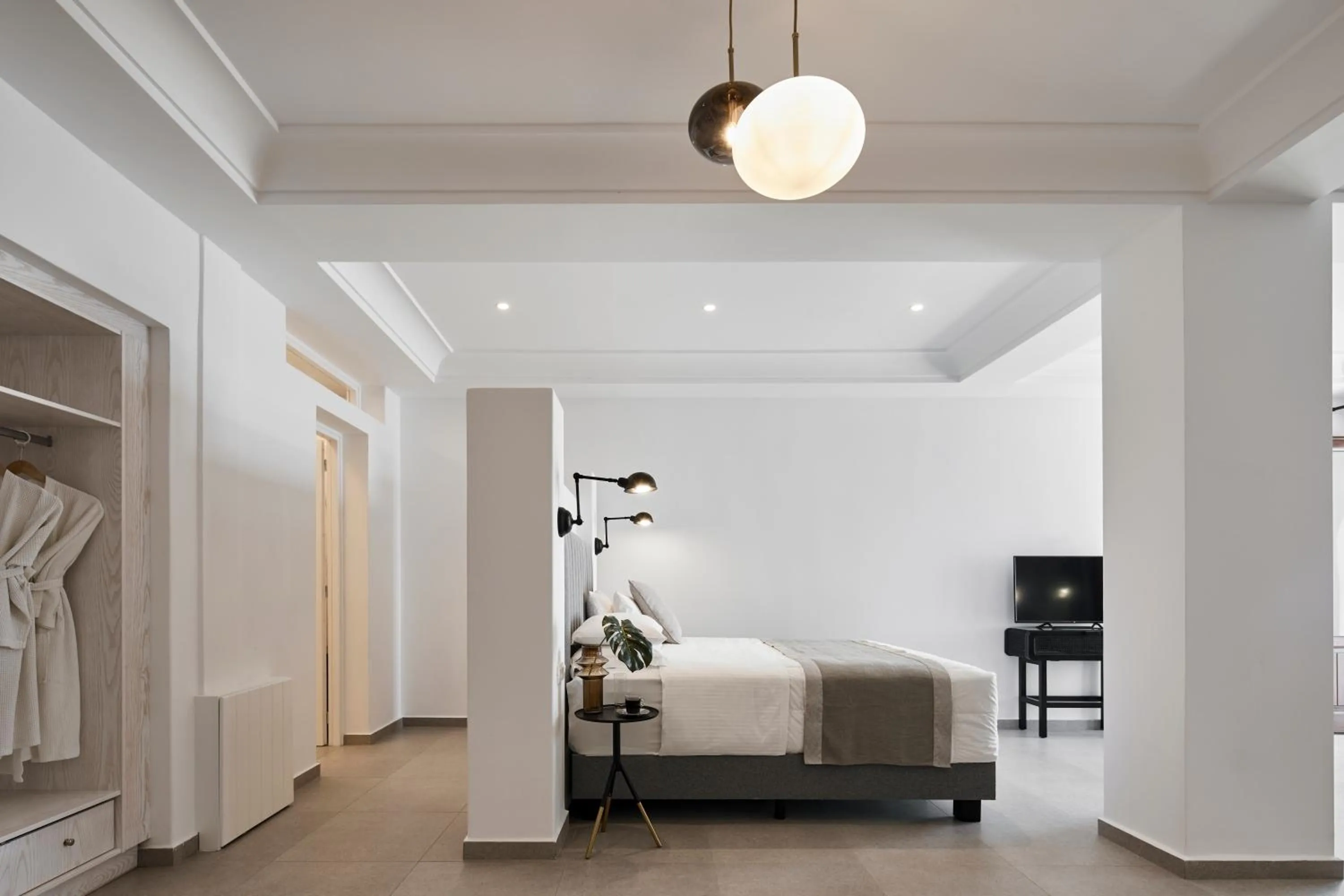 Bed in Petit Palace Suites