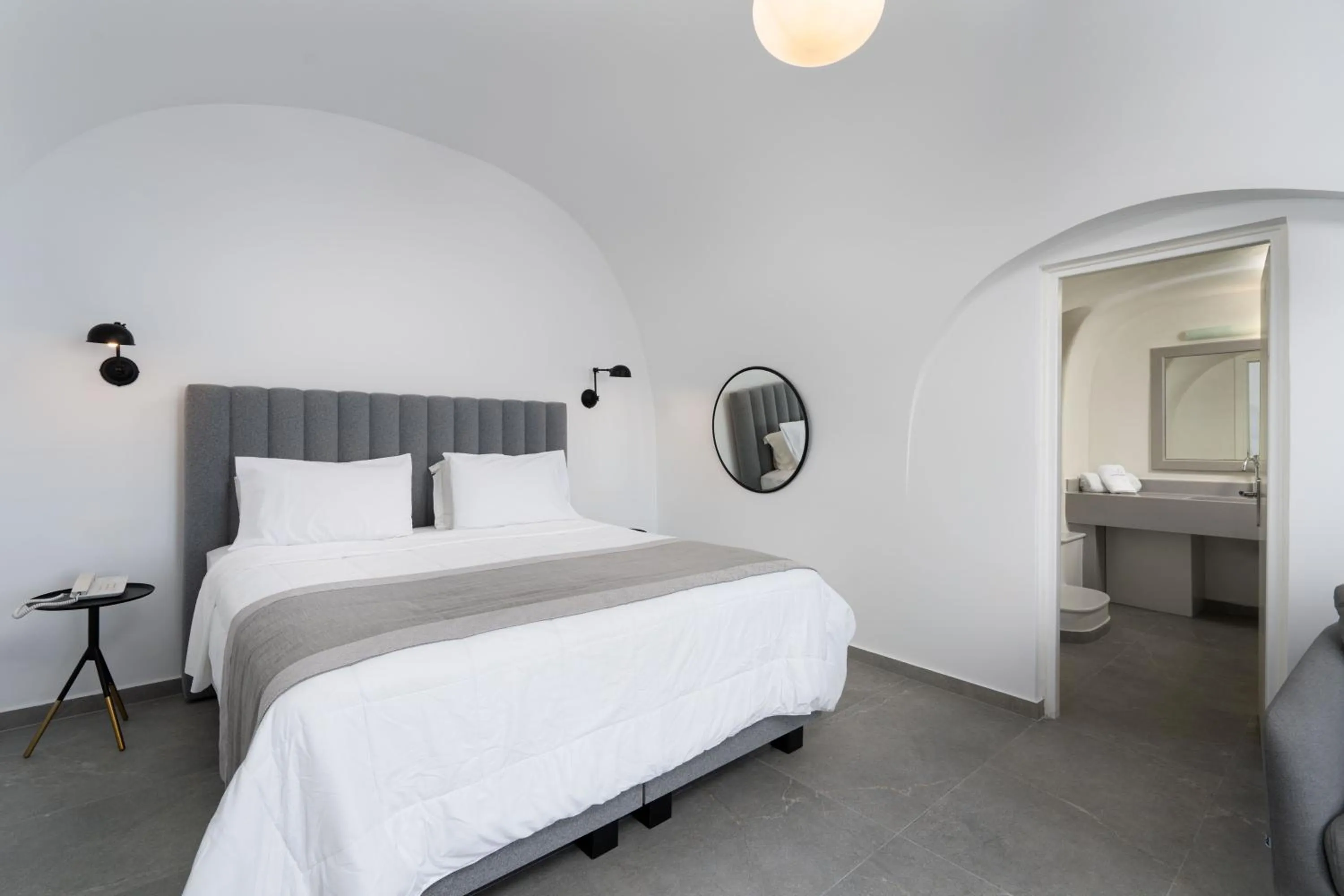 Bed in Petit Palace Suites