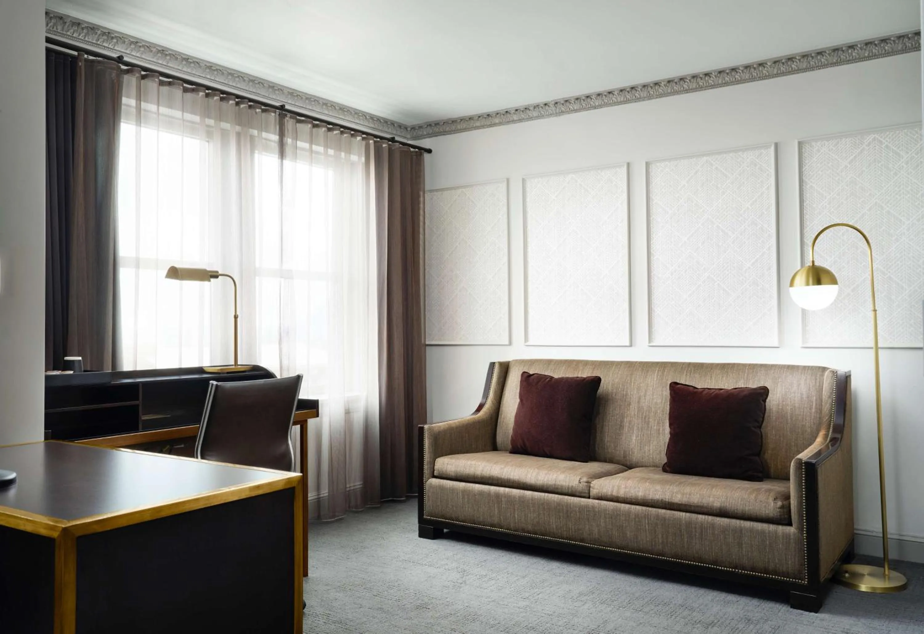 Living room in Hotel Phillips Kansas City, Curio Collection By Hilton