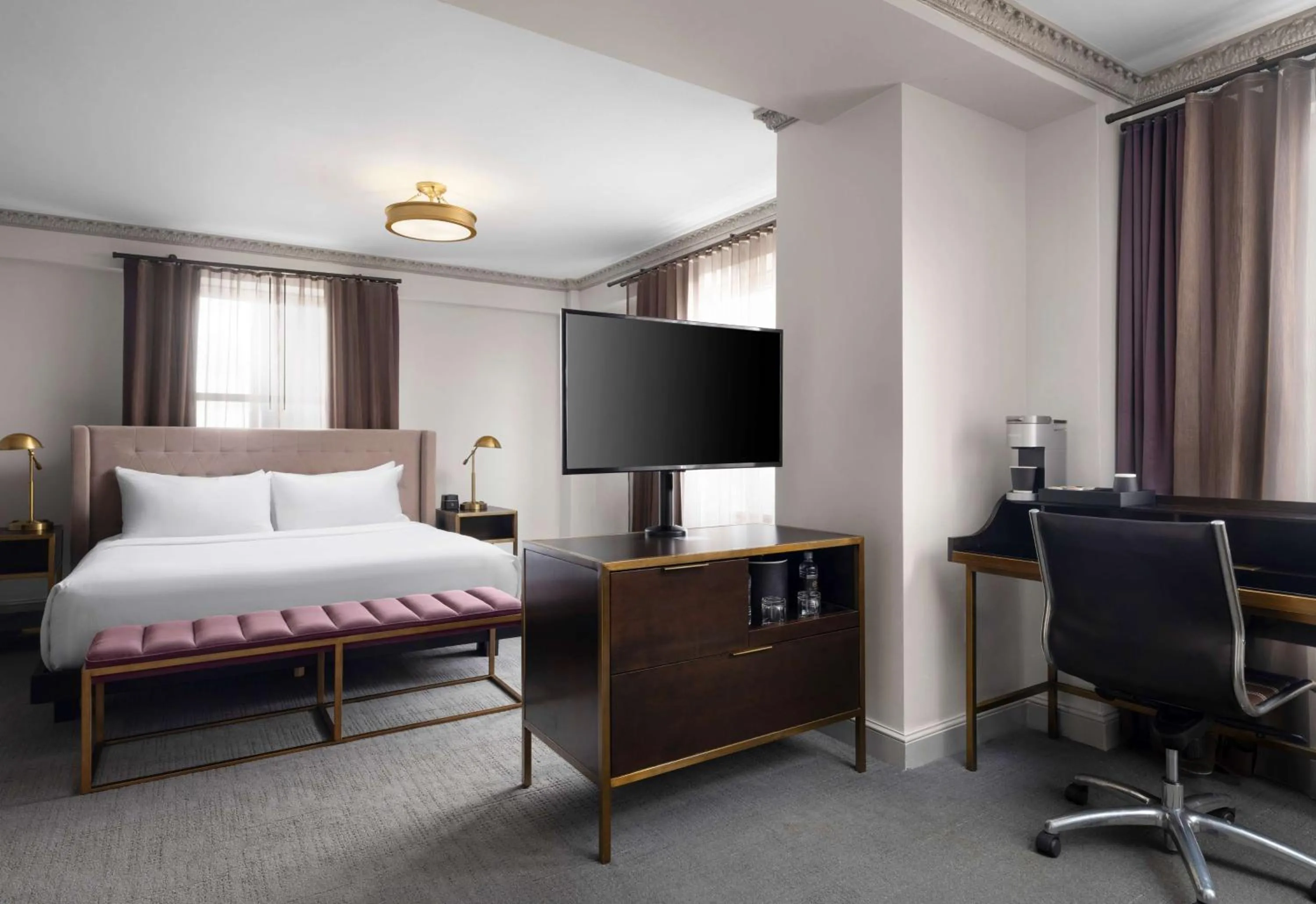 Bed in Hotel Phillips Kansas City, Curio Collection By Hilton