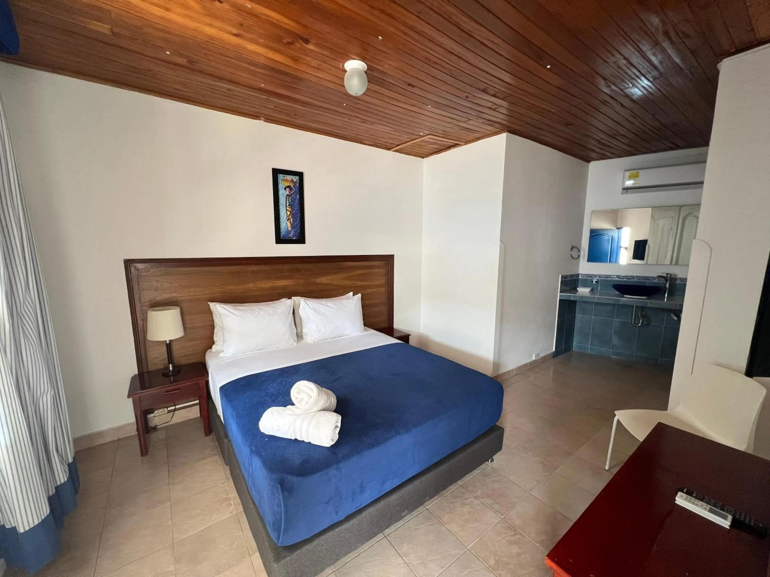 Photo of the whole room, Bed in La Ballena Azul Hotel