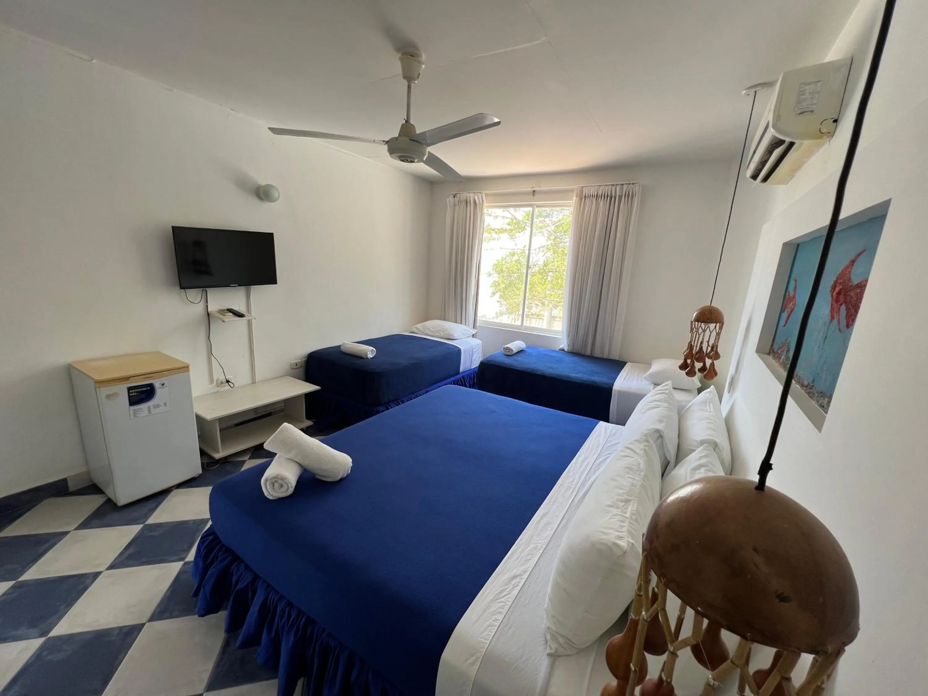 Bed in La Ballena Azul Hotel