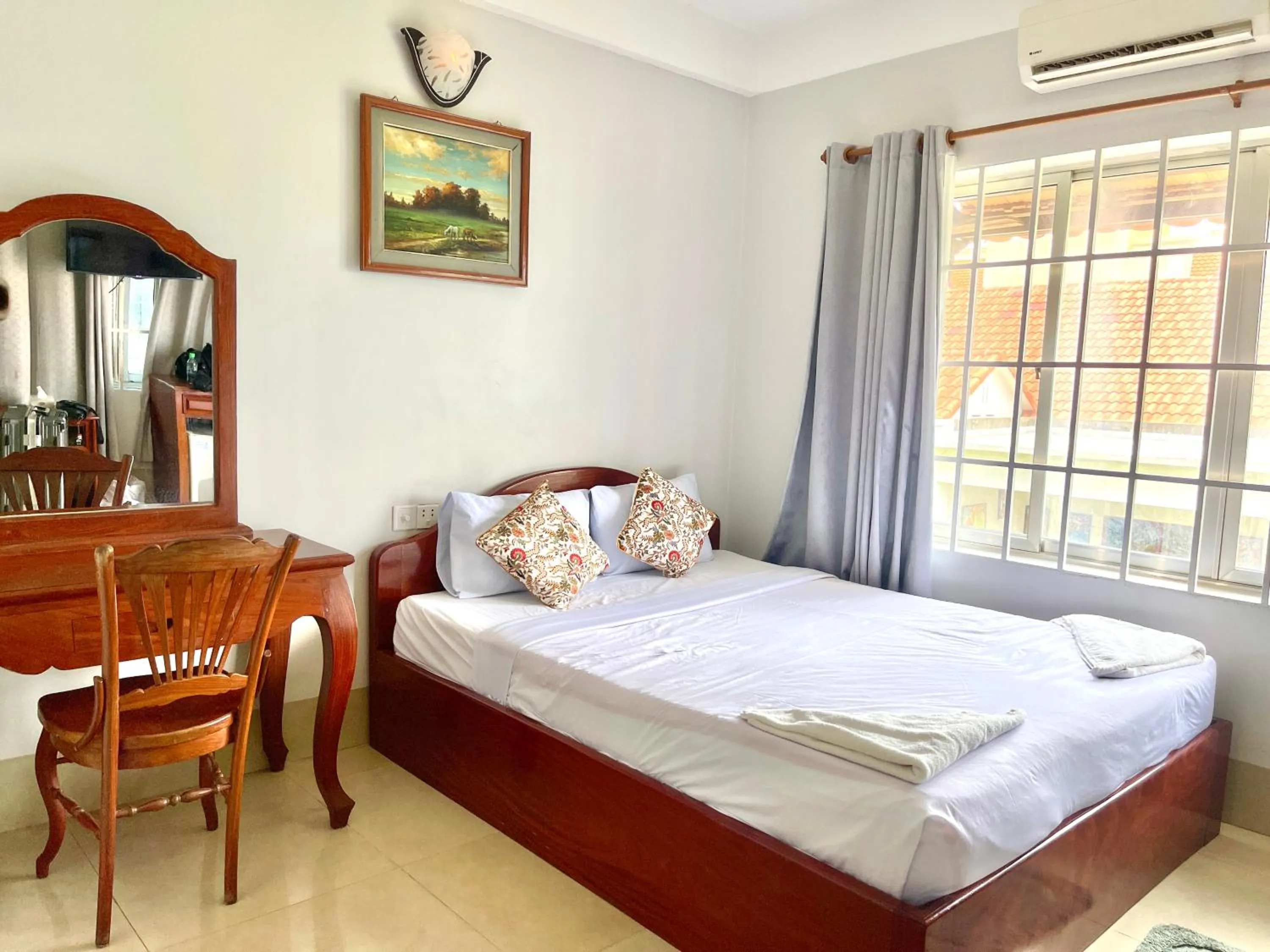 Photo of the whole room, Bed in Siem Reap Riverside Hotel