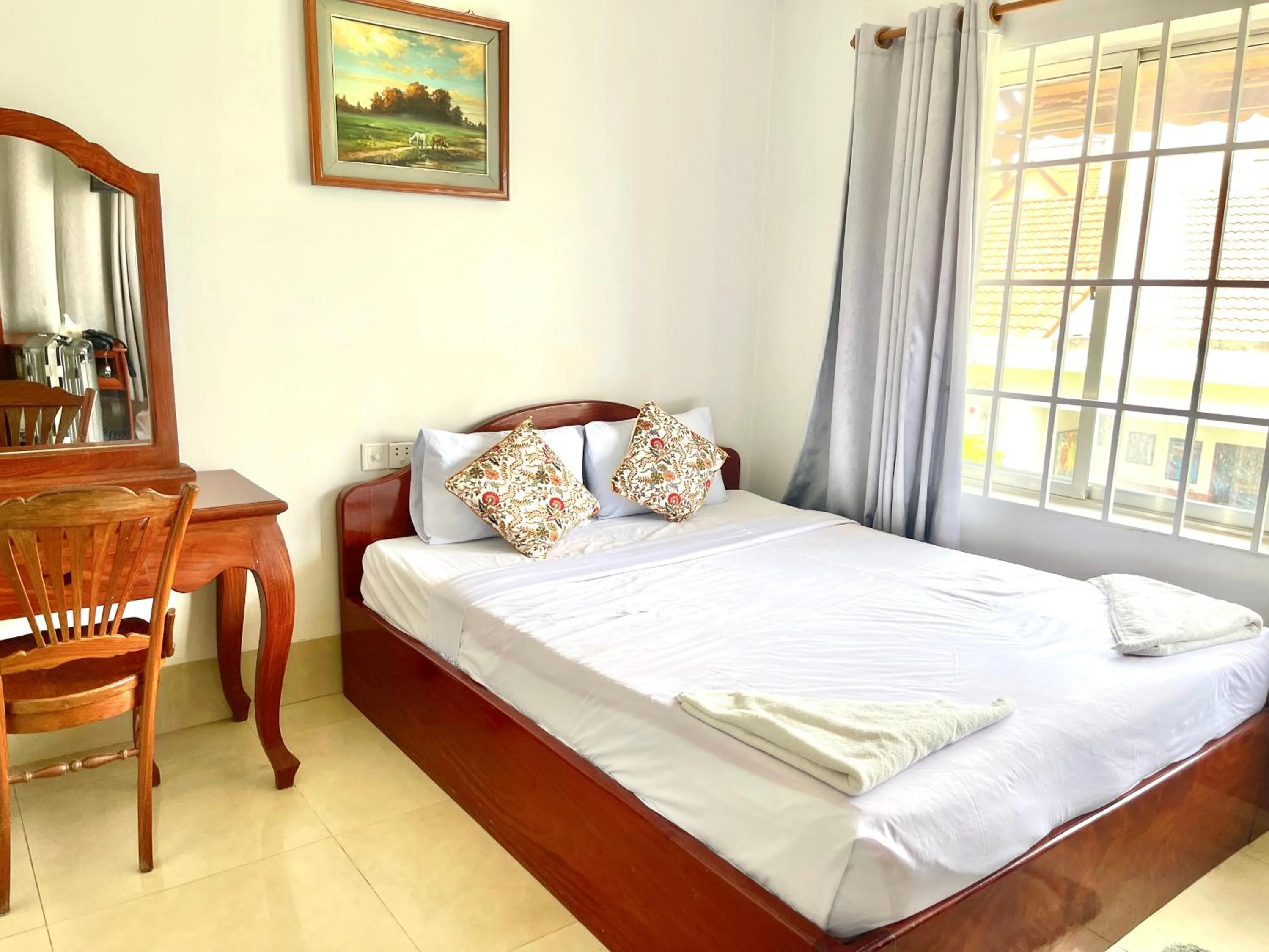 Bed in Siem Reap Riverside Hotel