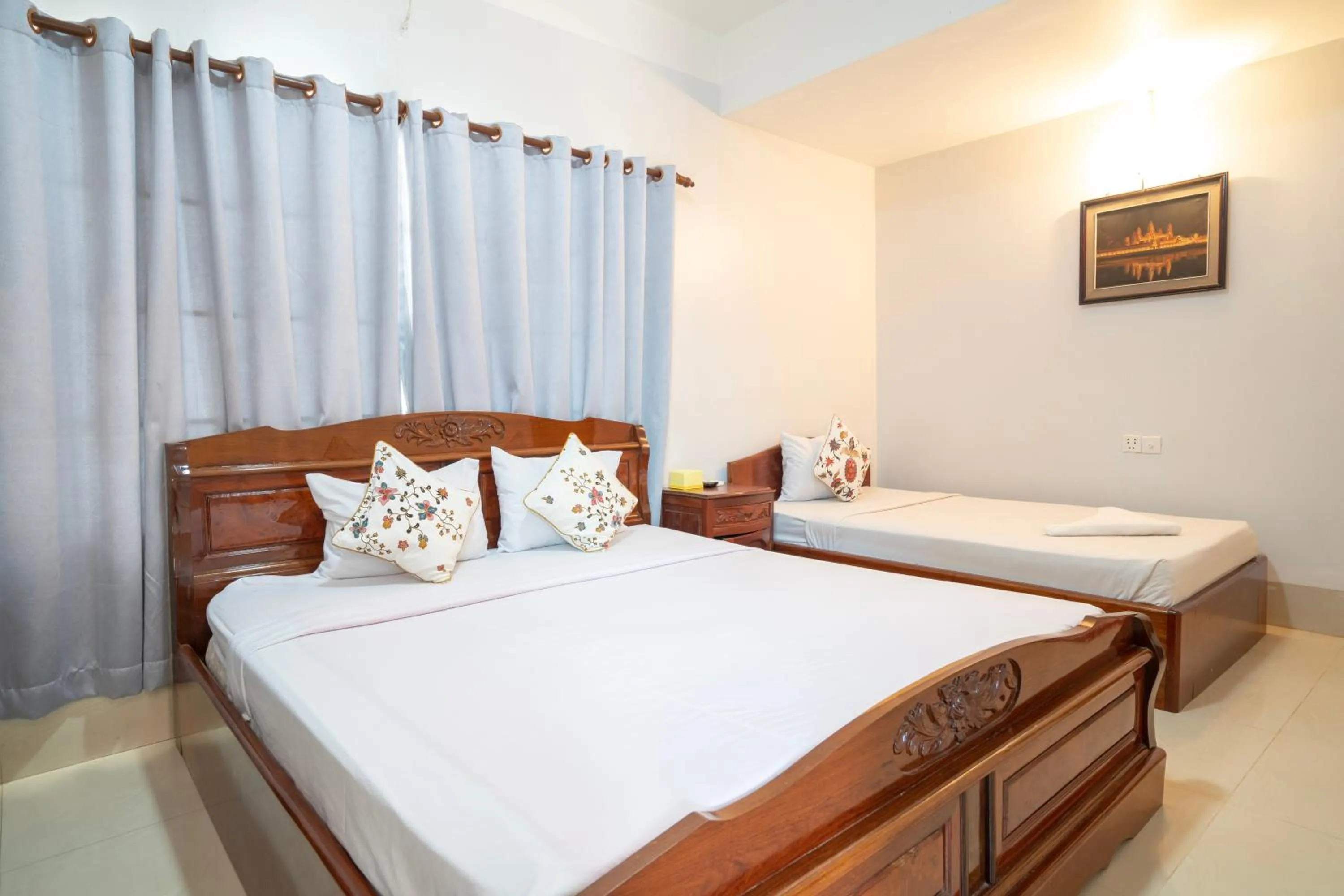 Bed in Siem Reap Riverside Hotel