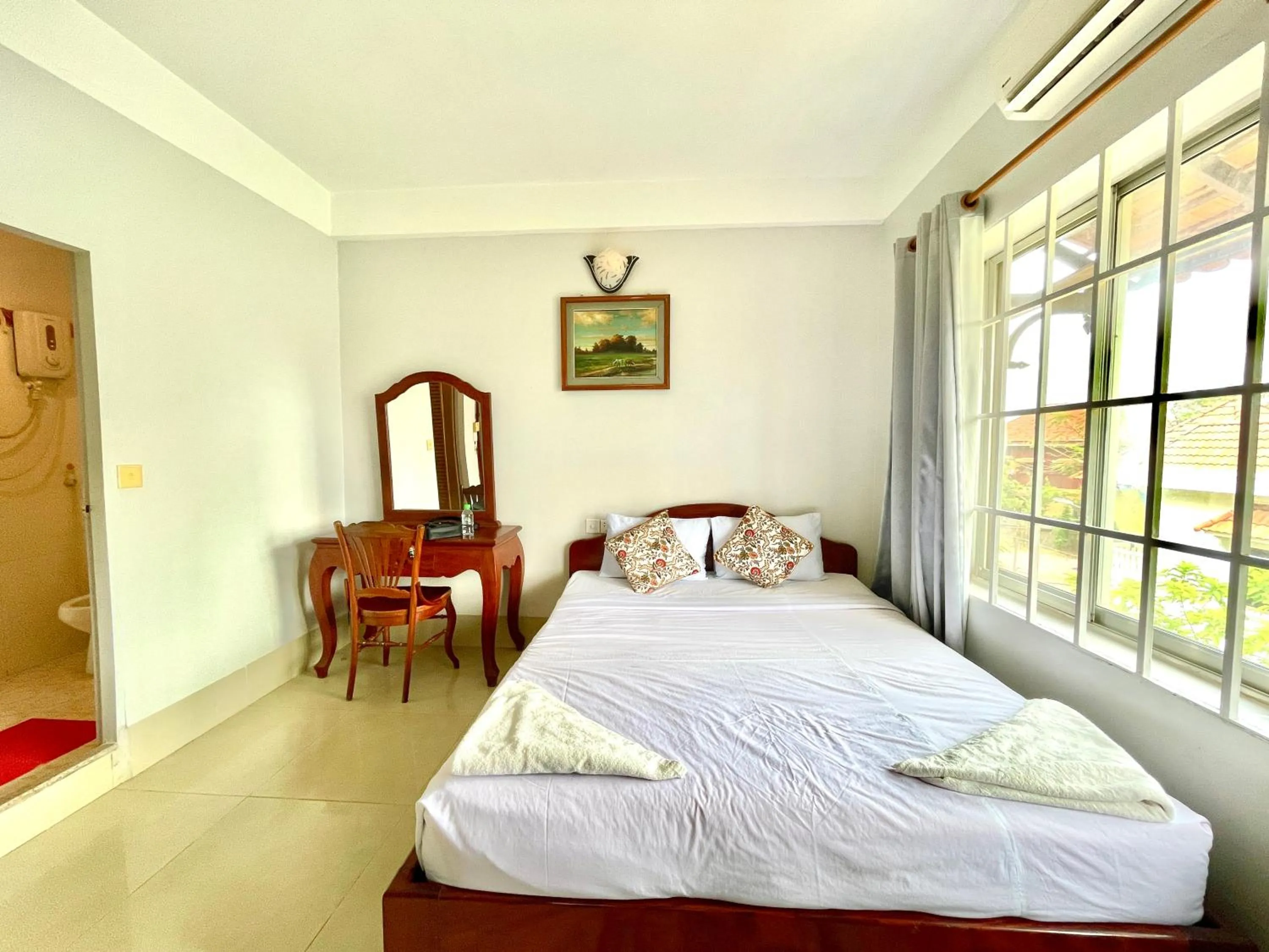 Photo of the whole room, Bed in Siem Reap Riverside Hotel