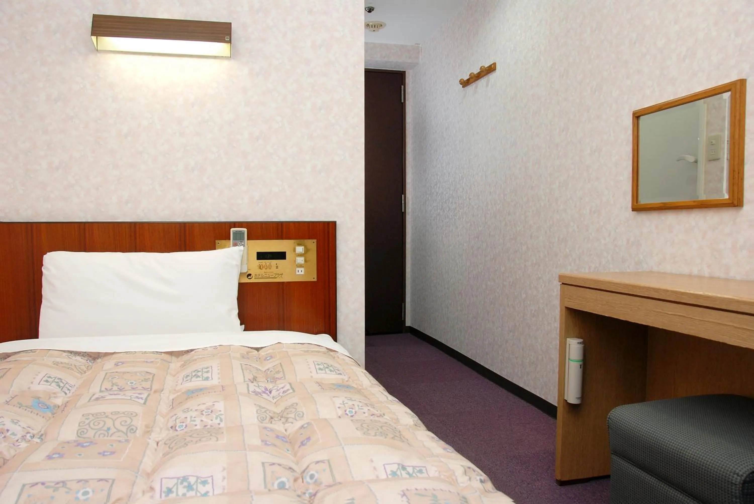 Bed in Hotel New Plaza Kurume