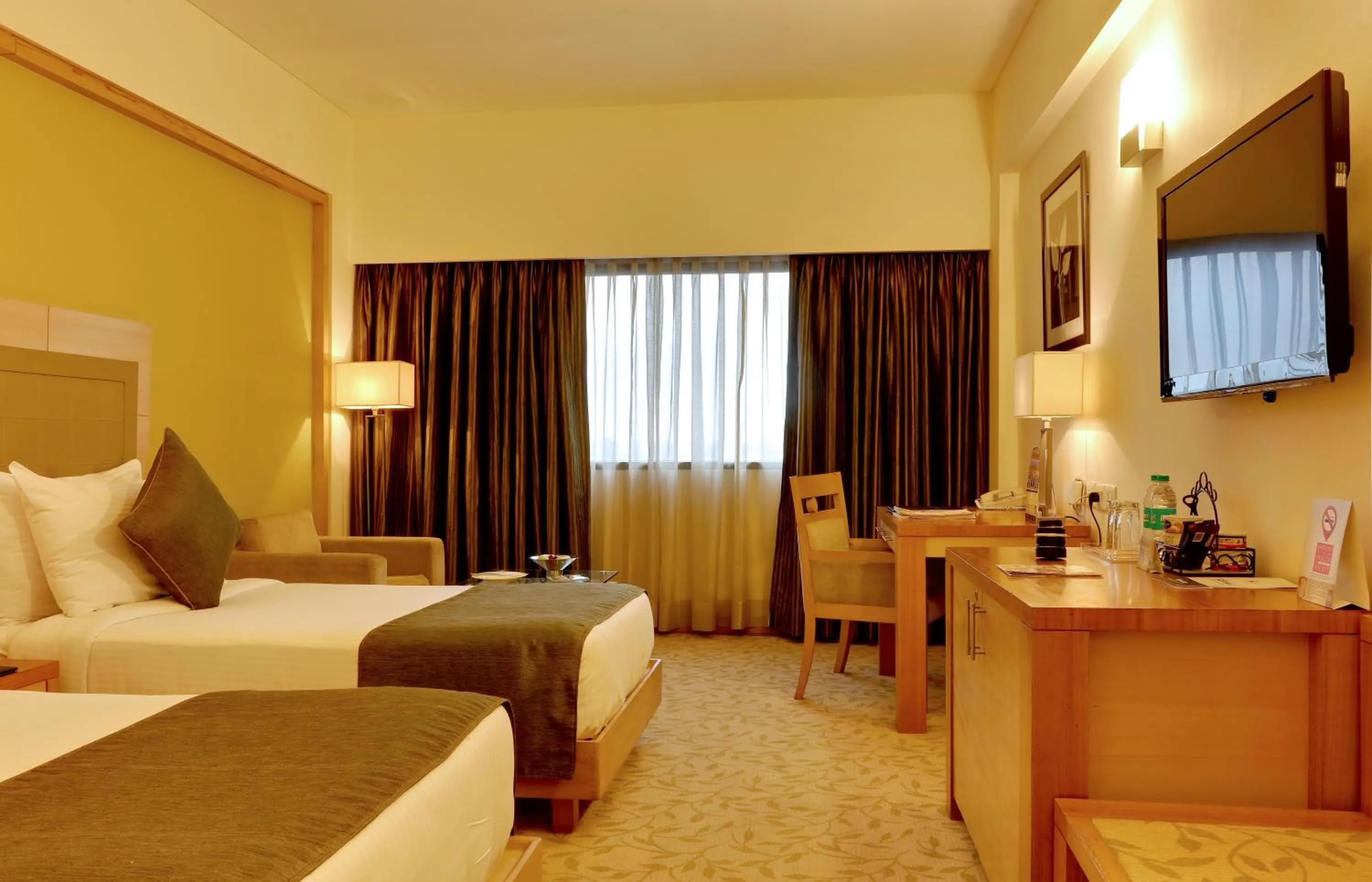 Photo of the whole room, Bed in The Suryaa New Delhi