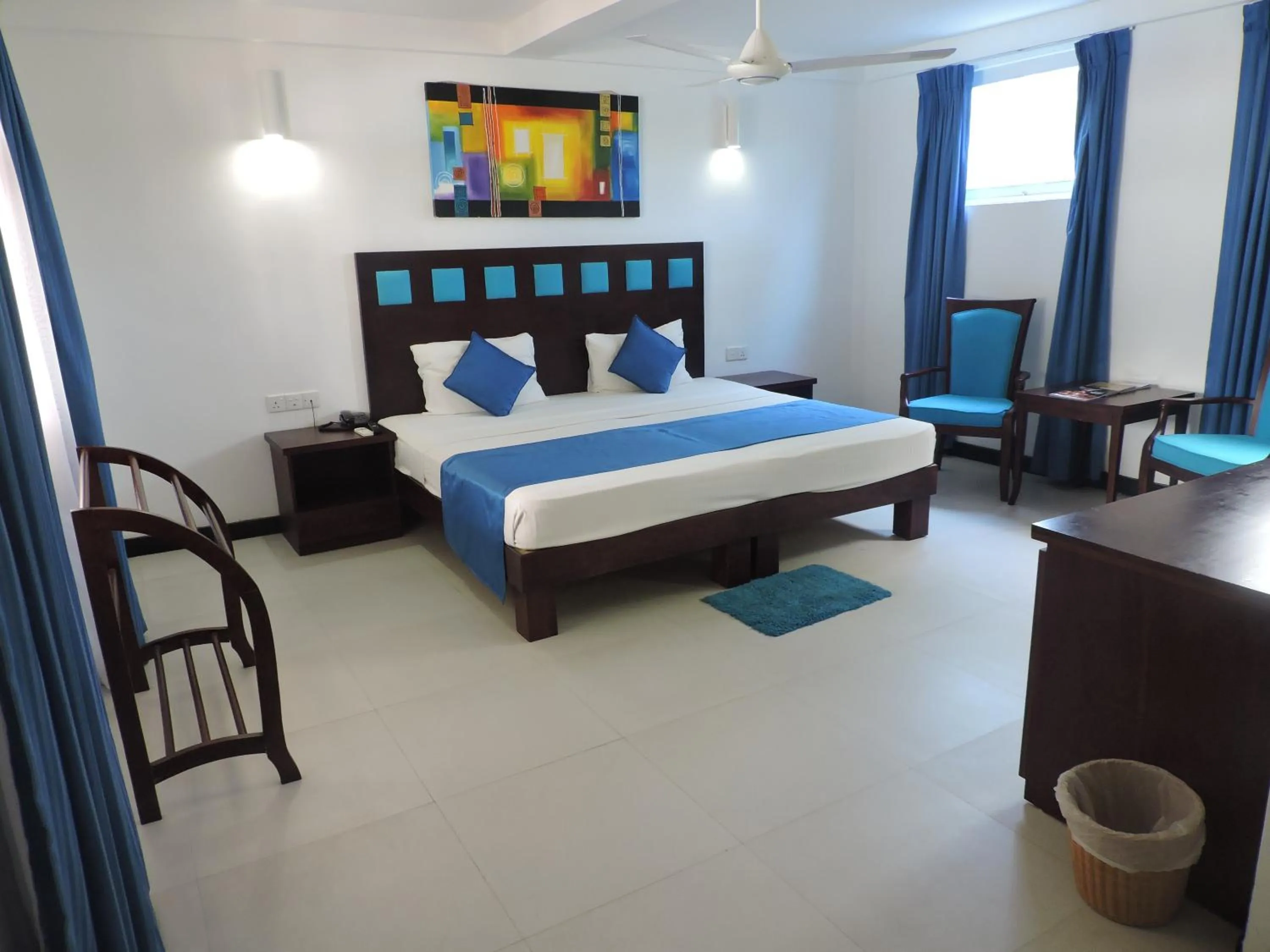 Photo of the whole room, Bed in Pigeon Island Beach Resort and Spa