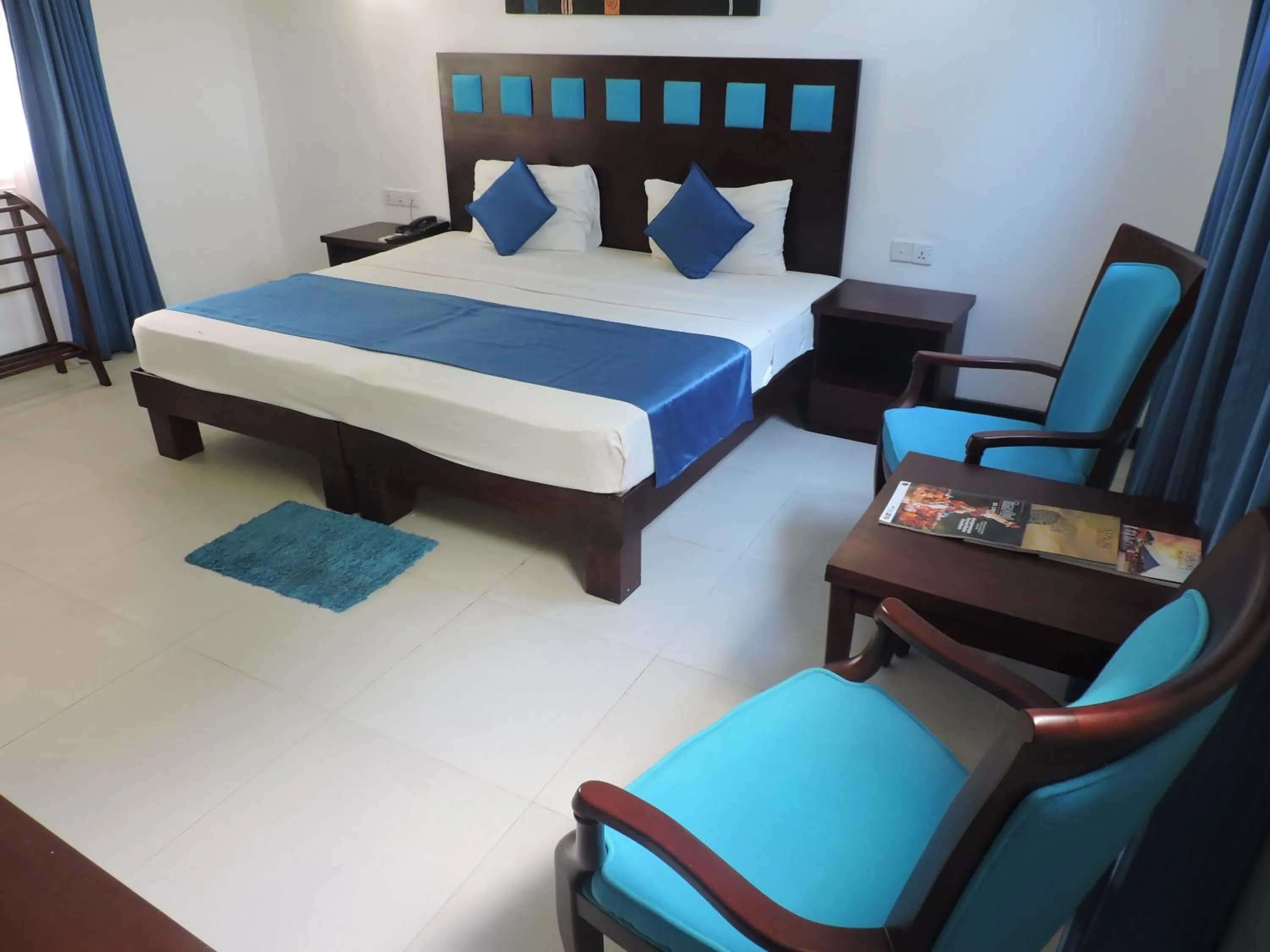 Photo of the whole room, Bed in Pigeon Island Beach Resort and Spa
