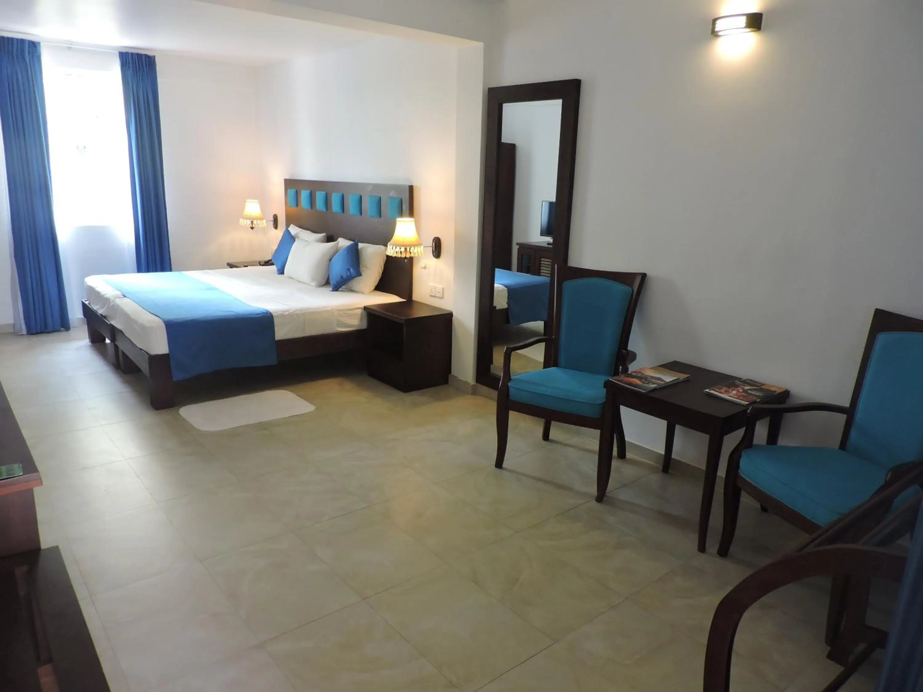 Bedroom, Bed in Pigeon Island Beach Resort and Spa