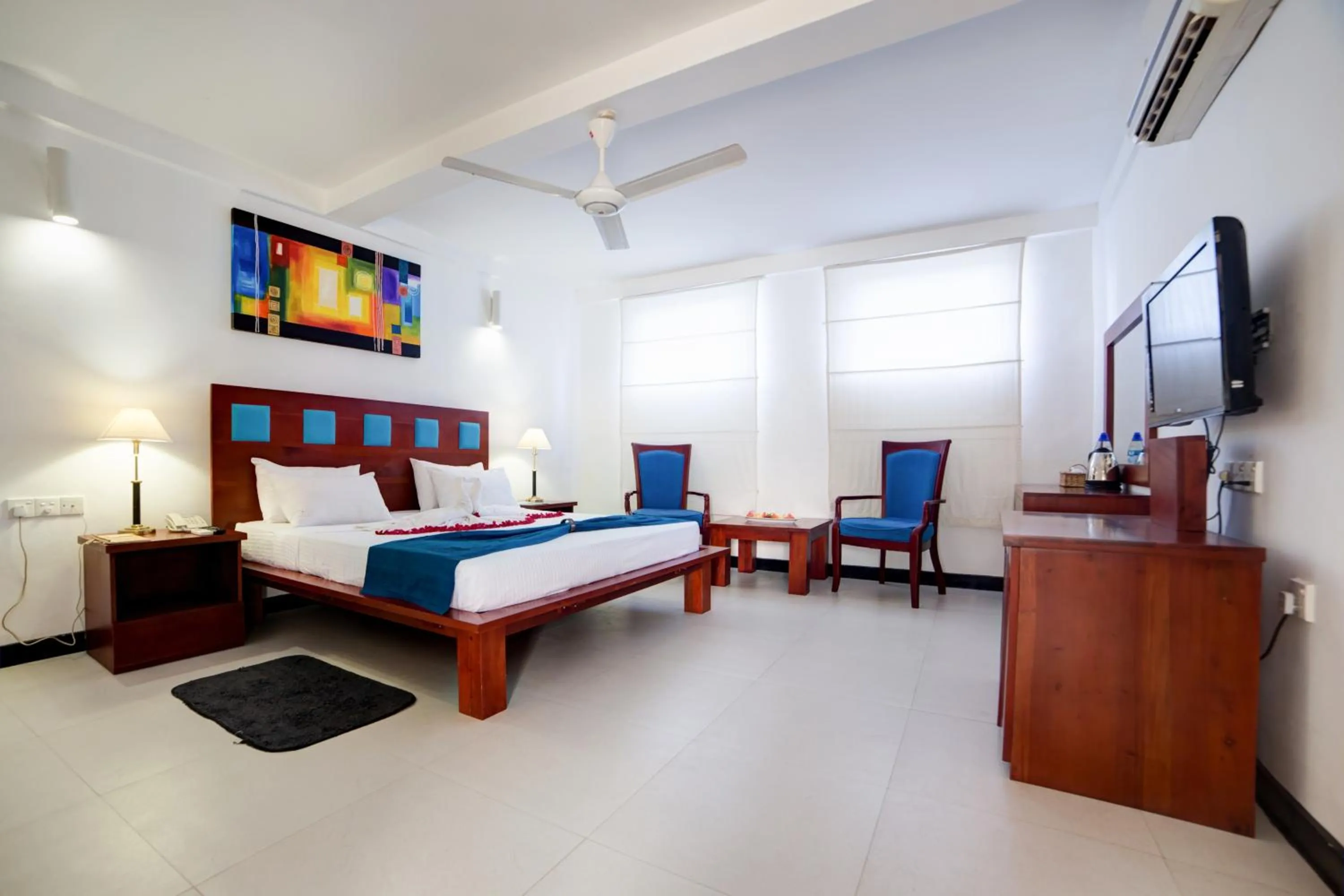 Photo of the whole room, Bed in Pigeon Island Beach Resort and Spa
