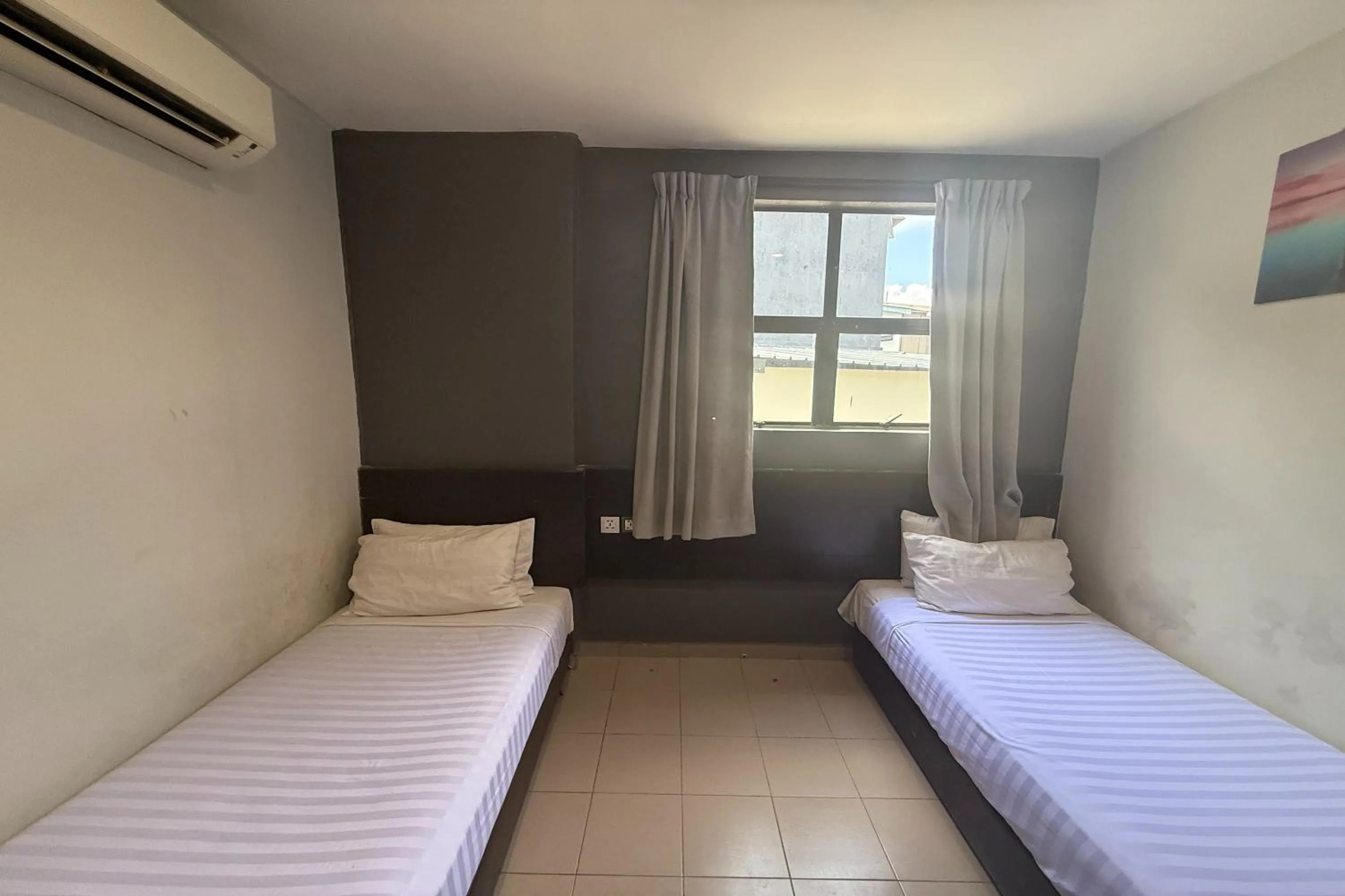 Bed in Tiong Nam Hotel