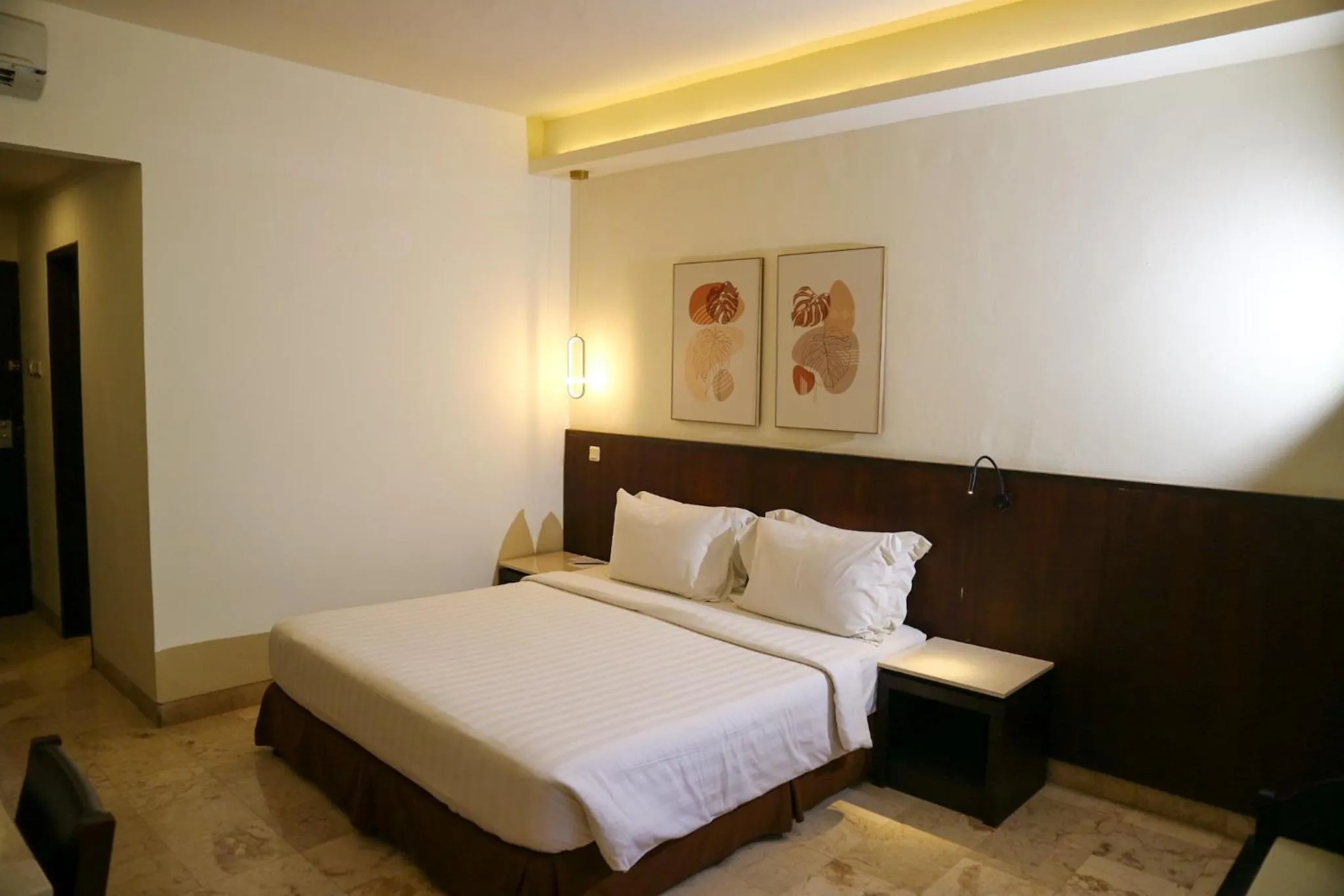 Bed in The Lagoon Bali Pool Hotel and Suites