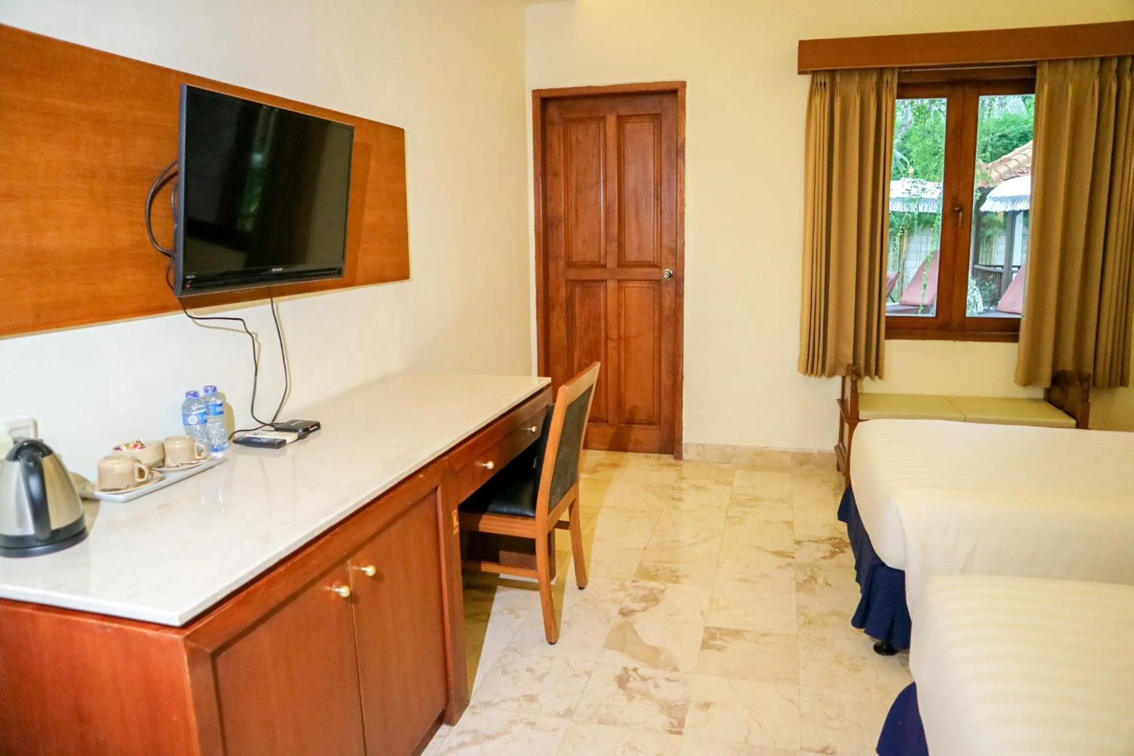 Bed in The Lagoon Bali Pool Hotel and Suites