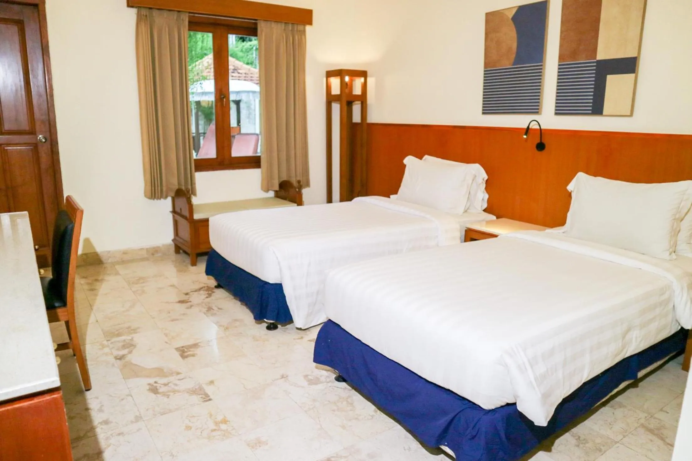 Bed in The Lagoon Bali Pool Hotel and Suites