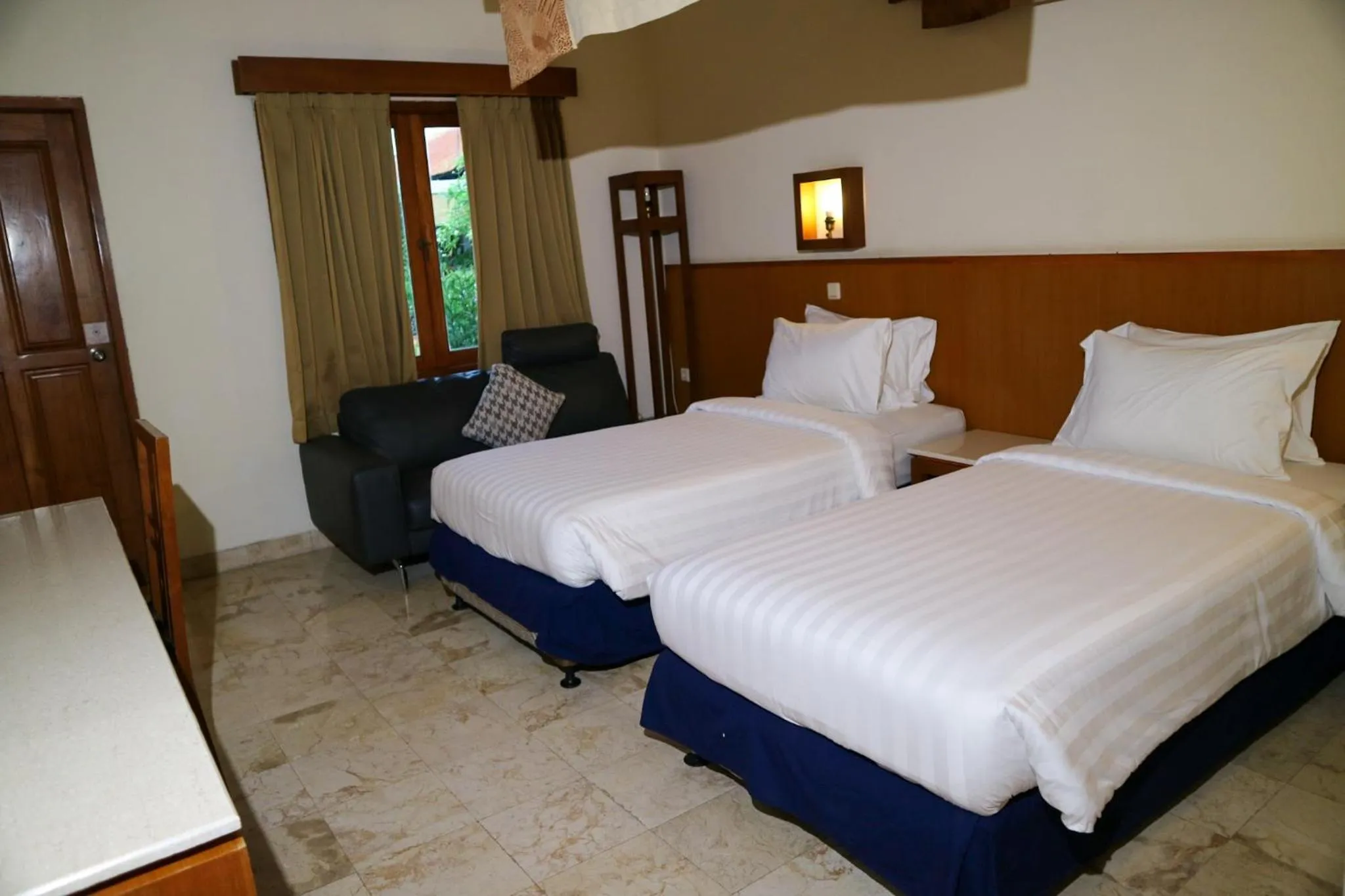 Bed in The Lagoon Bali Pool Hotel and Suites